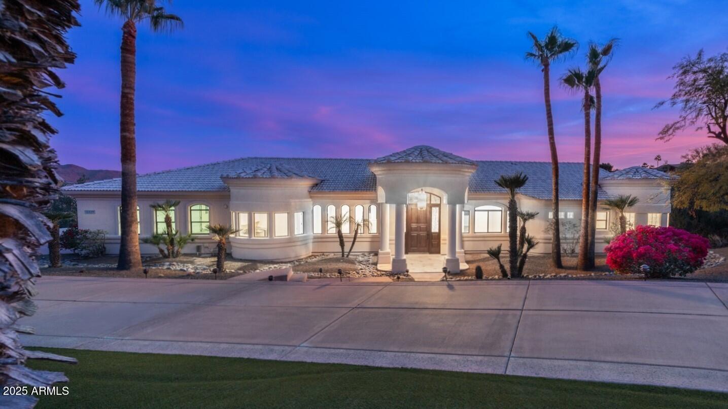 Nestled on an elevated, 1.27 ACRE HOMESITE overlooking the natural beauty of Sonoran Desert terrain, this timeless, architecturally inspiring home was designed to capture BREATHTAKING VIEWS! Spacious estate with approximately 7,000 square feet under roof, offering a flexible floor plan, expansive covered balcony, large covered patio, covered porch, and oversized garage. Luxury and quality throughout, including artistic wood/glass front door, beautiful gourmet kitchen, granite countertops, travertine, marble, warm woods, separate office, separate sitting room/den, guest suite, spectacular main suite, and more ($100,000+ in 2024 renovations). The resort-style rear yard completes this magical setting with an amazing pool, water feature, inviting spa, stunning sunsets, and SCENIC VIEWS!