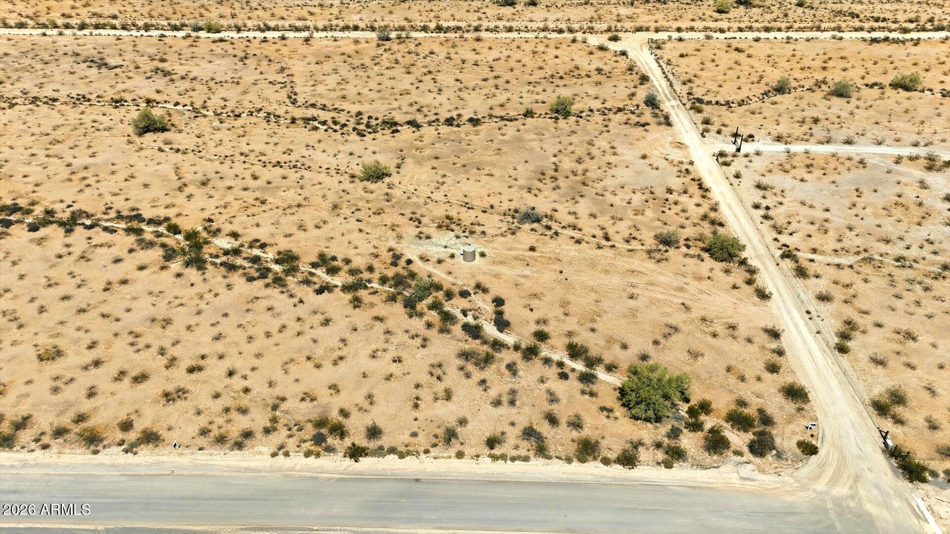 Location meets lifestyle! This stunning 2.09-acre parcel offers the rare ''best of both worlds'': serene rural privacy with No HOA, just minutes from the city's booming retail corridor.

Standout Feature: A private well(2500gal) (installed 2022) with full ownership conveying--no shared water, giving you total control. Your north-facing backyard borders the permanently preserved Gila River Reservation, guaranteeing protected, panoramic mountain views and city lights for a lifetime.

Level and build-ready, this lot is perfect for a custom ranch, guest casita, workshop, or equestrian setup. Easy I-10 access makes for a seamless commute to Phoenix/Tucson. Experience the most talked-about pocket in Casa Grande! (Additional adjacent lot also available for 4.2 total acres).