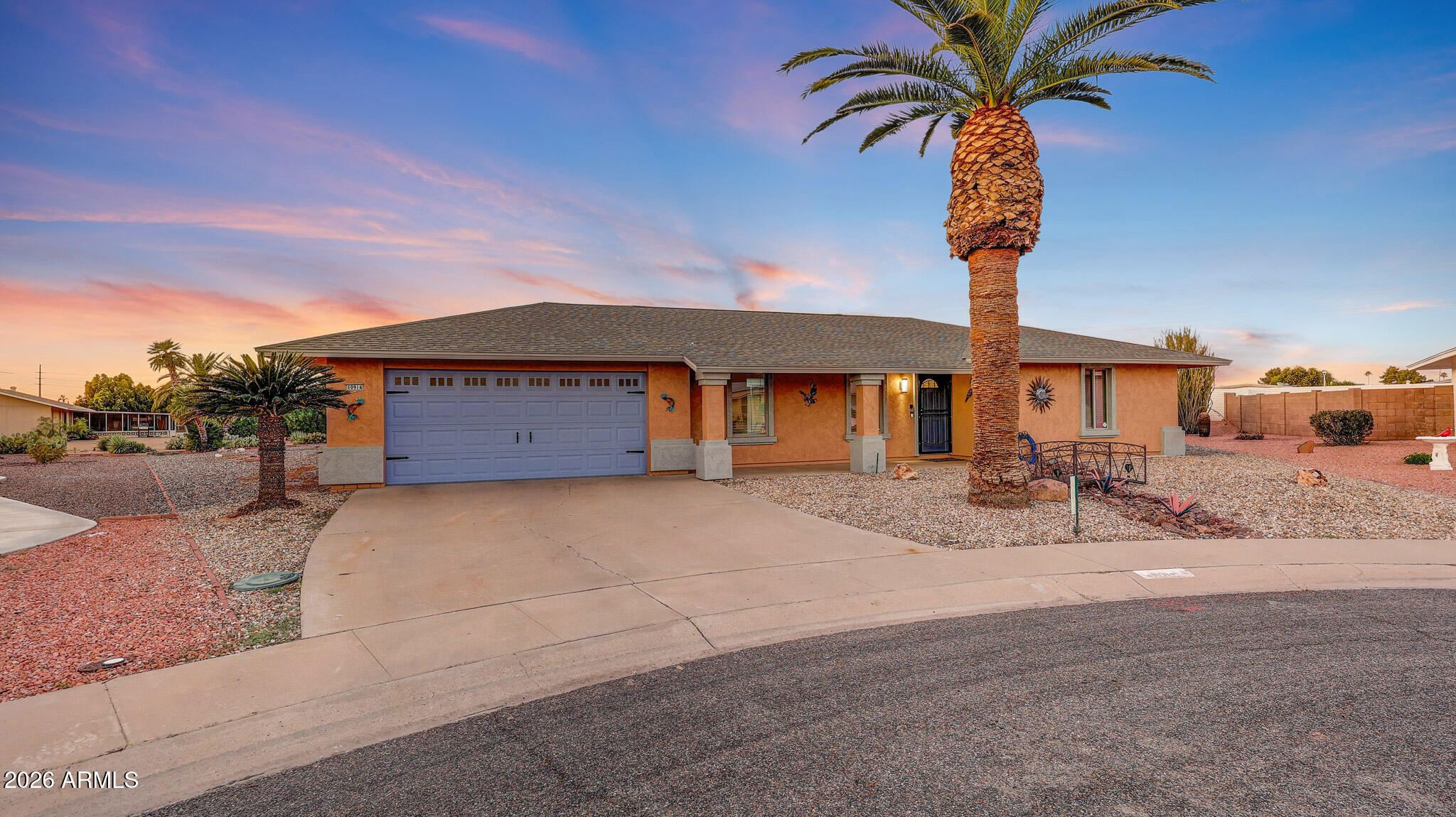 Experience elevated living in this tastefully remodeled, singe-story Del Webb residence - offering 2 bedrooms, 2 bathrooms, and a 2-car garage - ideally positioned on a truly expansive cul-de-sac lot with a sparkling play pool and brand-new privacy block walls. Upon entry, you're welcomed by rich hardwood flooring flowing through the main living areas, complemented by new flooring in both bedrooms. This beautifully remodeled kitchen is a true showpiece, thoughtfully redesigned with exquisite quartzite countertops, a custom tiled backsplash, walk-in pantry, new picture window, recessed lighting, double ovens, and premium CAFÉ appliances (GE's exclusive luxury collection). 
The home's upgrades exemplify quality at every turn: a new roof (2023), all-new interior and closet doors, fresh interior and exterior paint, wainscoting in the eat-in kitchen, all new ceiling fans and upgraded mirrors, stylish backsplashes, and an electric bidet toilet.
A beautifully appointed Arizona room invites relaxation, showcasing oversized windows, tile flooring, and a dedicated A/C wall unit. From here, take in views of the sprawling backyard sanctuary - complete with new landscaping and trees, real and artificial grass areas and a sparkling play pool enhanced with a new pump, new tile, and features a serene waterfall feature. A large covered patio and a 2-car garage with a dedicated workshop area and built-in cabinetry further elevate the property.
All windows throughout the home are upgraded dual-pane solar windows. The front exterior impresses with refreshed landscaping, a decorative garden bridge, new wall sconces, a Ring doorbell camera, digital Wi-Fi door lock and a Wi-Fi-enabled garage door opener offering seamless smartphone access.
Kitchen refrigerator conveys..... and with a full-price offer, the seller will include a beautifully appointed premium golf cart - adding exceptional value to this already extraordinary home.