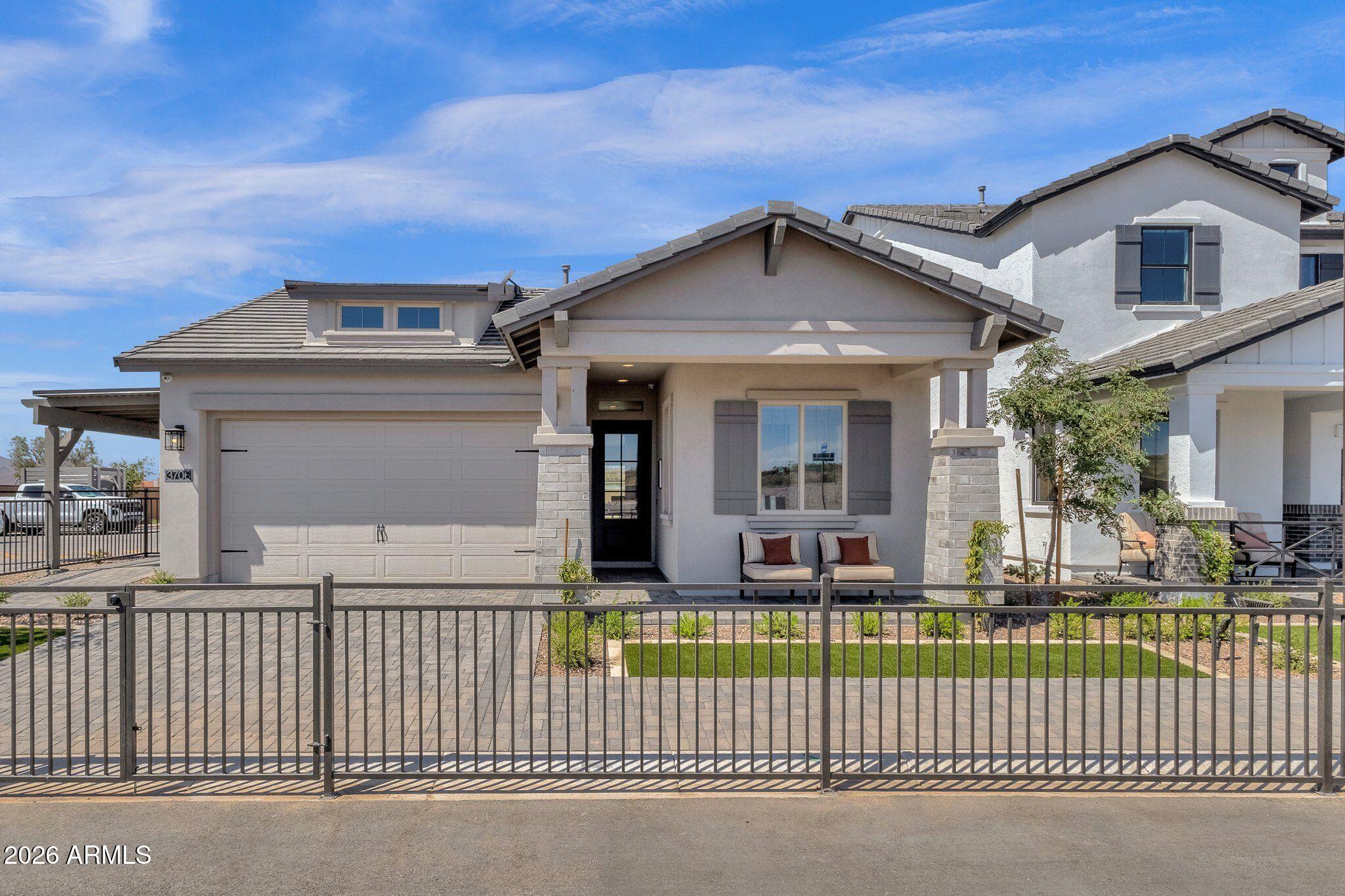 Most everyone's real estate dream is to buy a highly amenitized model home at a bargain price.  Opportunity is now knocking.  Spectacular model home available with an option to purchase it partially or fully furnished. This home is loaded up with beautiful finishes and landscaping.  Way too much to list but here are some highlights: Iron front door, all tile, no carpet, Quartz kitchen countertops, full tile backsplash, upgraded cabinets, task lighting, toe lighting, quality appliances and matching refrige.  Never used washer and dryer set, laundry cabinets, sink  freestanding tub, plate glass shower on roller wheels and upgraded shower walls and primary bath vanity top.  Wall of glass leading to covered patio and backyard with lots of turf and and entertaining fireplace.  Taxes estimated.
