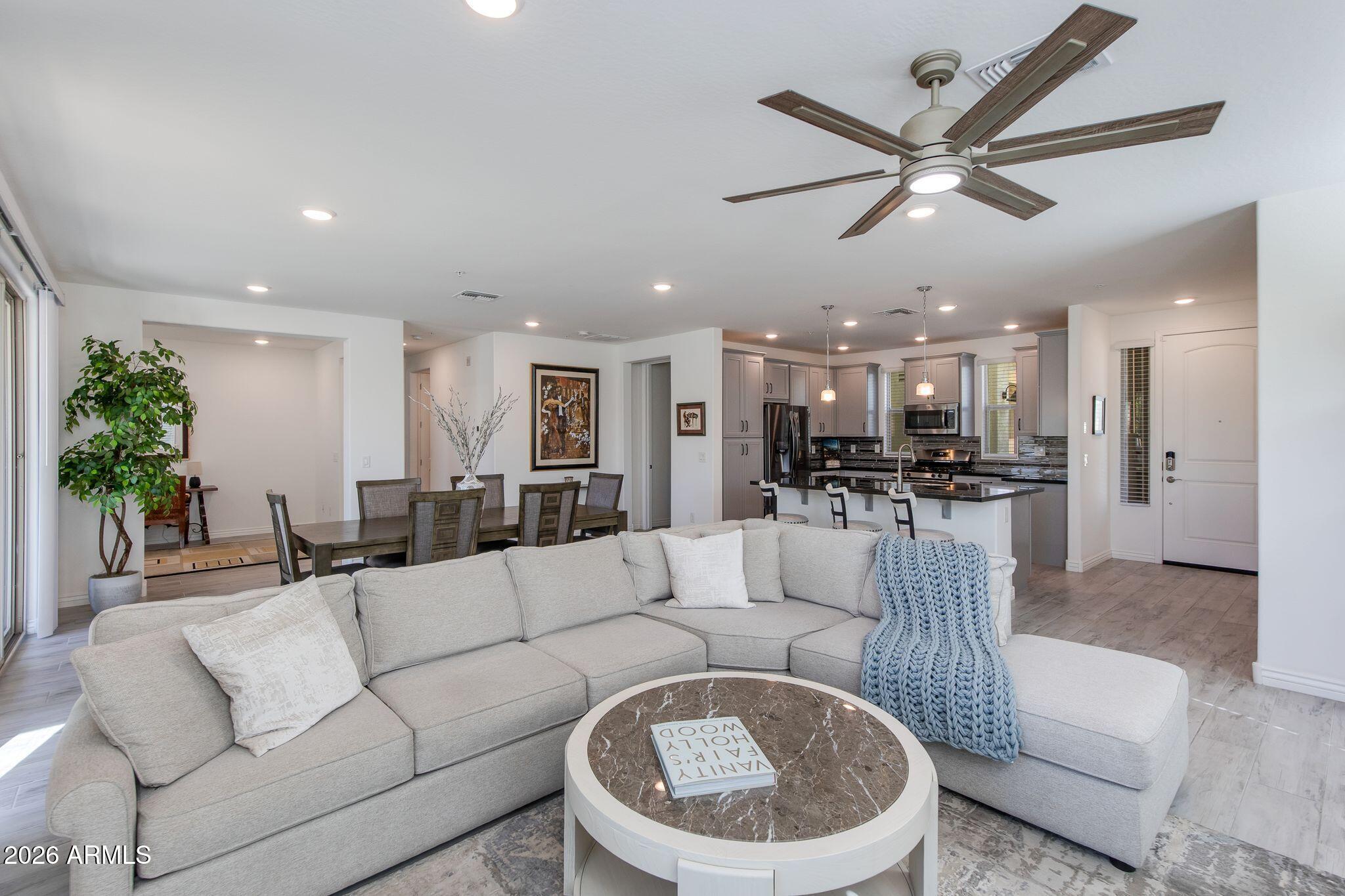 Built in 2018, this home blends modern finishes with functional design. The open-concept floor plan creates a seamless flow between the kitchen, dining, and living areas -- perfect for both everyday living and entertaining. The kitchen features stainless steel appliances, a spacious island ideal for gathering, and abundant cabinetry for storage. Tile flooring runs throughout the main living spaces, providing both durability and style, while the bedrooms offer plush carpet for added comfort.

A generous bonus room provides flexibility for a home office, media room, fitness space, or guest retreat -- ideal for today's evolving lifestyle needs. This thoughtfully designed living space is located in the sought-after Rancho North community.   Must See! Enjoy the convenience of low-maintenance condo living within a resort-style community featuring a pool, spa, and fitness center. Located in the desirable North Phoenix/Cave Creek area, you're just minutes from shopping, dining, golf, and outdoor recreation.

Modern comfort. Functional design. Exceptional location.