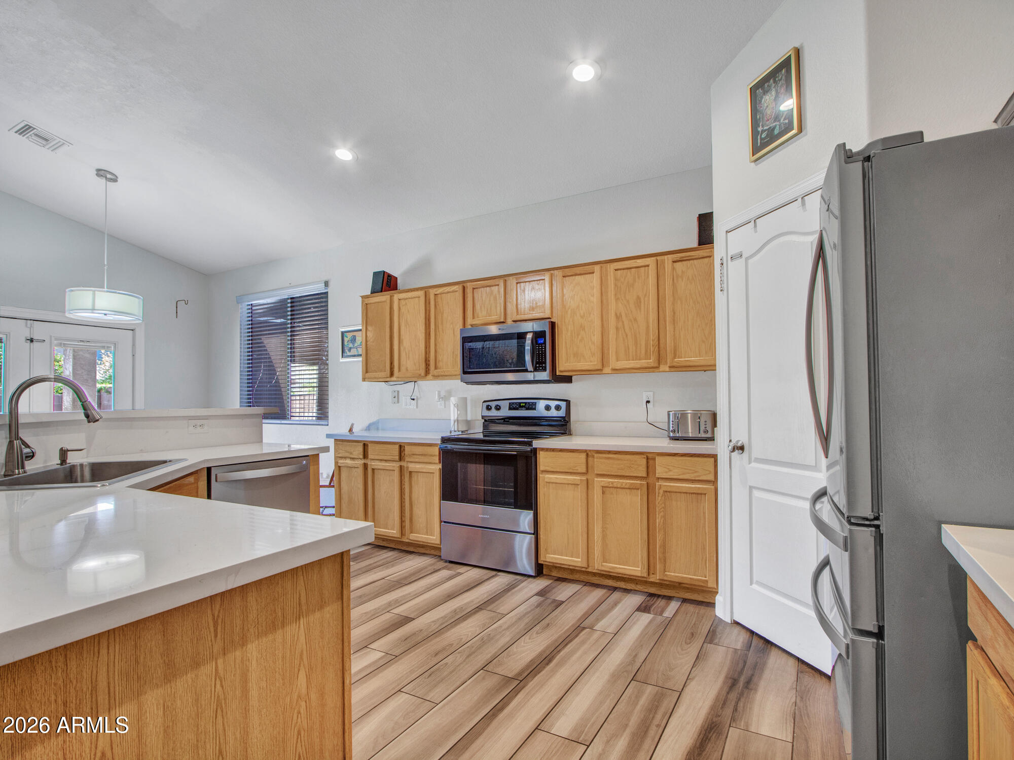Upgraded single-level with a new roof (2021) & new Trane AC (2019). Enjoy a resort-style backyard with a newer pool (2021) with water feature, paver patio, covered patio with pull-down shade, artificial turf, and firepit--perfect for entertaining.Inside features vaulted ceilings and wood-look tile flooring. Updated kitchen with oak cabinets, new quartz countertops, island, walk-in pantry, and stainless steel appliances. New carpet in all bedrooms, sunscreens & owned alarm system.The primary suite showcases a beautifully updated bathroom with a freestanding soaking tub, a custom tiled walk-in shower, new cabinetry, and modern light fixtures--creating a true spa-like retreat. Move-in ready with all the right upgrades. Conveniently located near shopping, dining & good schools & entertainment.