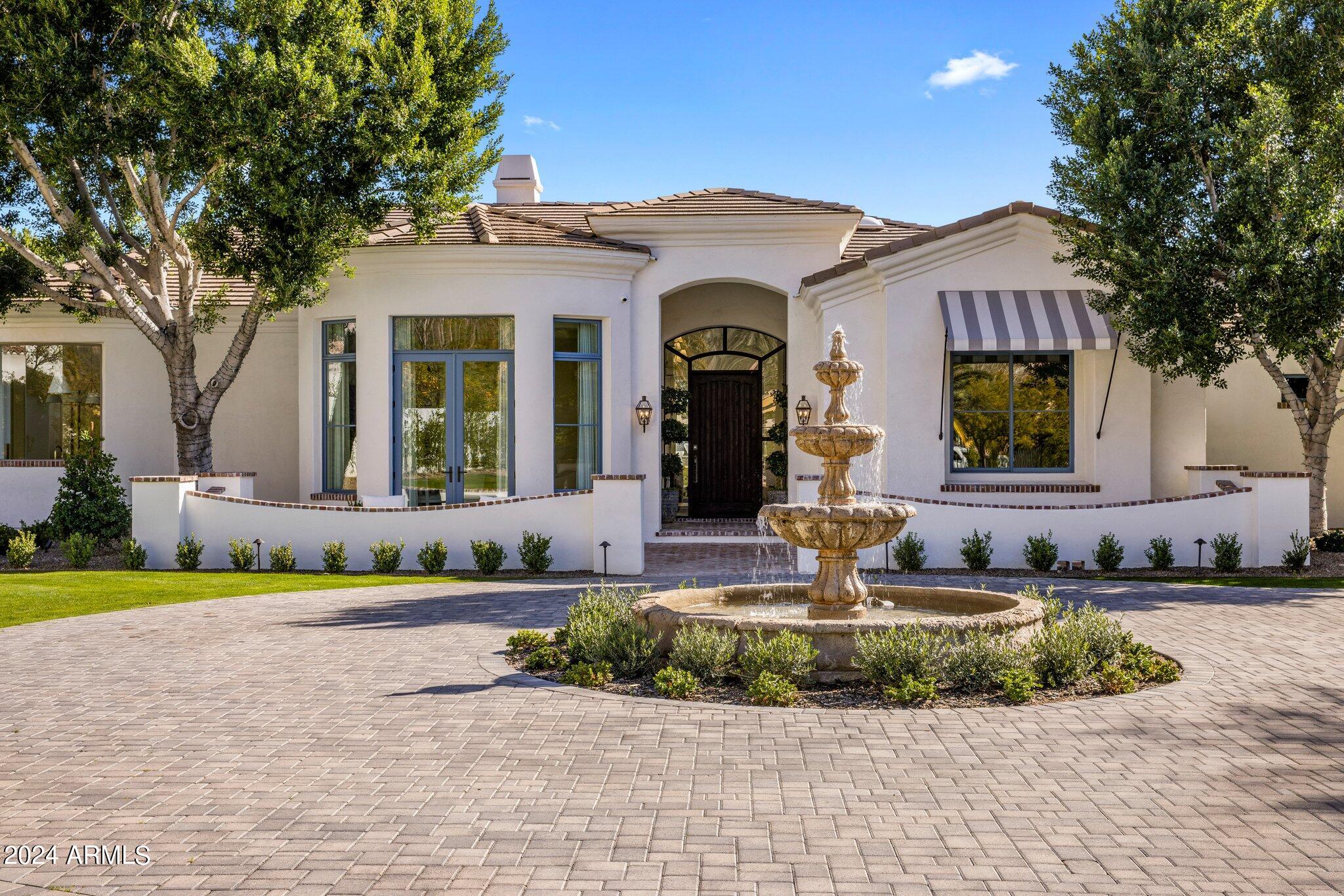 Introducing this impeccably remodeled residence nestled in the prestigious Royal Palm Estates subdivision at the southern foothills of Camelback Mountain. Beyond the gated driveway awaits a sprawling .94-acre property boasting awe-inspiring views of Camelback Mountain from both front and rear vantage points. Undergoing an extensive overhaul in 2022, this home exudes sophistication and quality craftsmanship throughout.