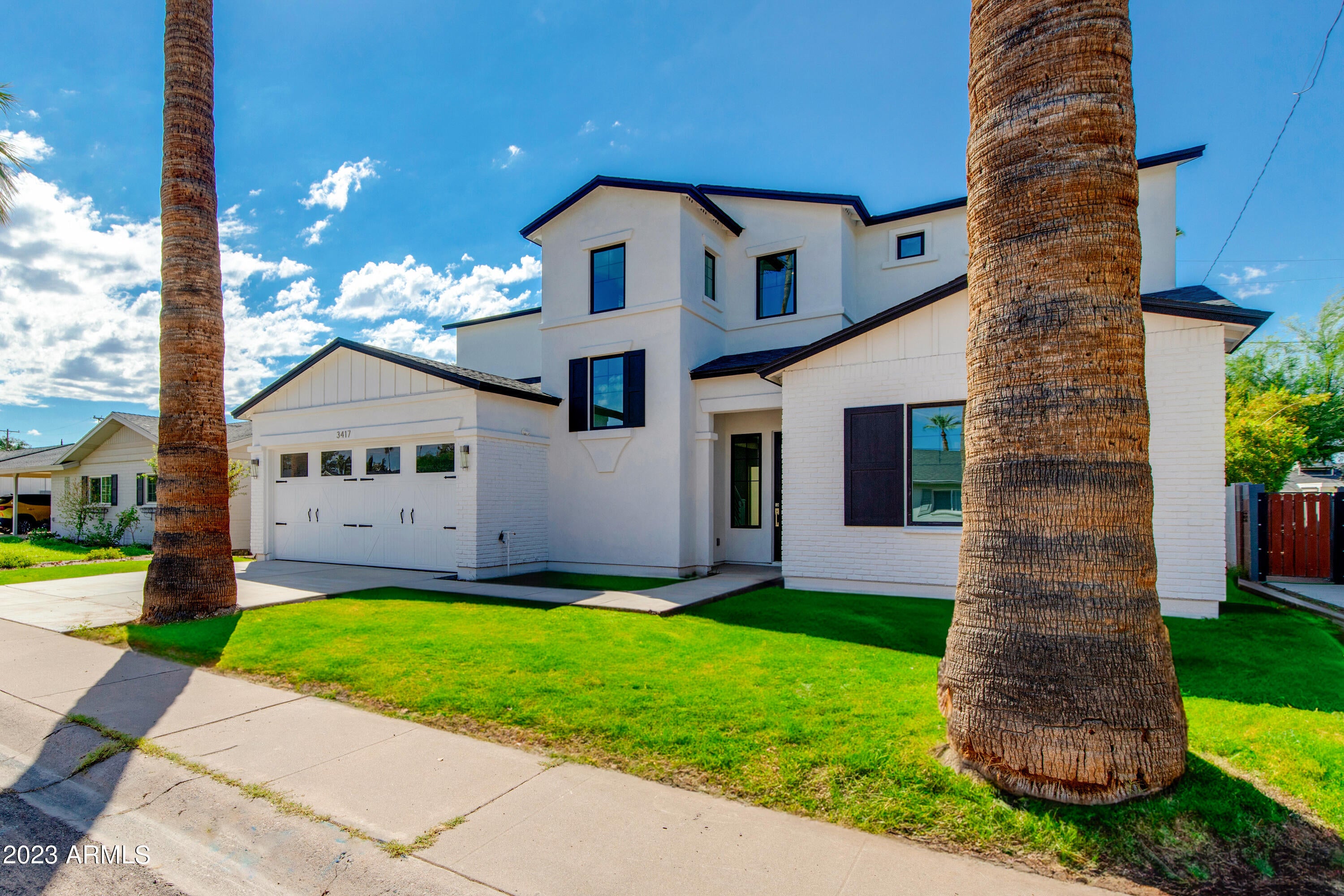 This newly built home in Arcadia Lite offers the perfect blend of modern comfort and classic Arizona charm. Featuring 5 bedrooms, 4 baths plus a loft, there is plenty of space for everyone. Step inside and you are greeted with a spacious living room flooded with natural light. The open floor plan promotes a sense of connectivity, making it perfect for both entertaining and everyday living.
The chef's kitchen offers a culinary haven and is equipped with Wolf appliances, custom cabinetry, and a large quartz waterfall island as the center piece. The downstairs primary suite is a serene retreat featuring a spa-like bathroom with a freestanding soaking tub, massive shower, dual vanities and a generously sized walk-in closet. Enjoy close proximity to some of the best restaurants and shopping Phoenix has to offer. Guest suite downstairs and 3 beds and 2 baths upstairs. 2-car garage. Ample storage.