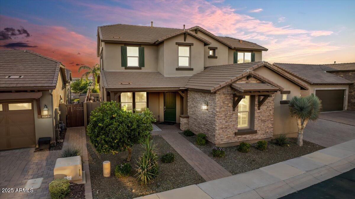 Welcome to The Estates at Ridgeview—a private, gated neighborhood in the heart of Desert Ridge offering spacious, comfortable living with a floor plan designed for today's lifestyle.
This beautifully maintained Ashton Woods home features 6 bedrooms, 5.5 bathrooms, and over 4,100 square feet of highly functional space. The layout includes 3 bedrooms and 3.5 bathrooms on the main level, and 3 bedrooms, 2 bathrooms and a large game room/playroom upstairs, offering exceptional flexibility for family living, guests, or working from home. The 6th bedroom is a true bedroom with its own closet and full bath, yet works perfectly as a flex room—ideal for a gym, playroom, hobby space, or guest suite depending on your needs. The open-concept great room connects seamlessly to a spacious kitchen and casual dining areaideal for everyday living and entertaining. The kitchen features a large island, granite countertops, 42" cabinetry, a butler's pantry, and abundant storage for effortless functionality.
The private primary suite is located on the main level and includes a relaxing bath with a soaking tub, walk-in shower, and dual vanities. Additional downstairs bedrooms also feature their own en-suite bathsgreat for guests or extended family.
Upstairs, the game room/playroom offers plenty of space for recreation, media, or lounge use with even a study nook, alongside three bedrooms and two full baths.
Step outside to enjoy Arizona living at its best with a custom pool and spa, low-maintenance turf, and peaceful desert wash views--a perfect balance of comfort and outdoor enjoyment.
Located near Pinnacle High School, the 51 freeway, Desert Ridge Marketplace, and REACH 11 nature trails, this home combines space, functionality, and convenience in one of North Phoenix's most desirable gated communities.