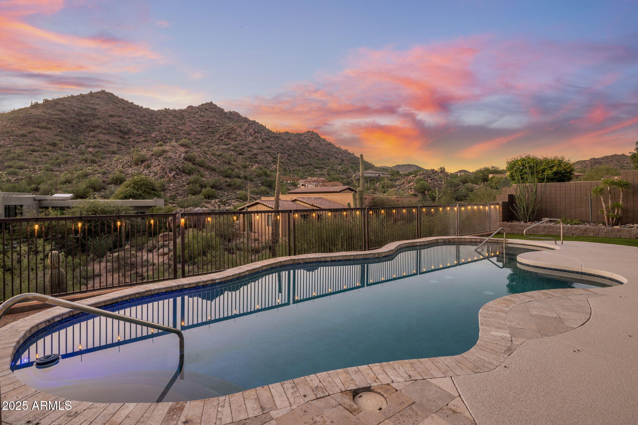 Welcome to this exceptional single-level home in the exclusive gated Hidden Hills subdivision of Scottsdale, perfectly positioned near mountain preserve trails and the Mayo Clinic. Enjoy breathtaking mountain views and a tranquil setting in one of the area's most desirable neighborhoods.
This fully remodeled home showcases luxury finishes and meticulous craftsmanship throughout. Every surface and detail has been thoughtfully updated, creating a seamless blend of sophistication and comfort. The open, split floor plan highlights soaring ceilings, abundant natural light, and a smooth flow for modern living.
The chef's kitchen features leathered granite countertops, a farmhouse sink, high-end appliances, and custom white oak cabinetry with abundant storage. The adjacent dining... The adjacent dining area includes a large built-in island and elegant shelvingperfect for entertaining family and friends.

The primary suite offers a true retreat, complete with a steam shower, dual vanities, granite countertops, and French doors leading to a private pool patio. The expansive walk-in closet conveniently connects to the laundry room for ultimate functionality.

Guests will appreciate the spacious en-suite guest room, featuring a large walk-in shower, custom shutters and drapery, and a serene atmosphere for privacy and comfort.

Additional features include a dedicated home gym with mountain views, a private office/study, and a flex space ideal for a craft room, music studio, or media area. The home also offers a whole-house audio system, motorized window treatments and sun shades (valued at over $100K), and ample storage throughout.

Step outside to enjoy resort-style living in your private courtyard and backyard oasis, complete with a sparkling pool, built-in BBQ, and expansive patio for entertaining. The 3-car garage provides plenty of room for vehicles and storage.

With unparalleled mountain vistas, modern upgrades, and a peaceful gated setting, this home offers the perfect blend of luxury, privacy, and Arizona living at its finest.