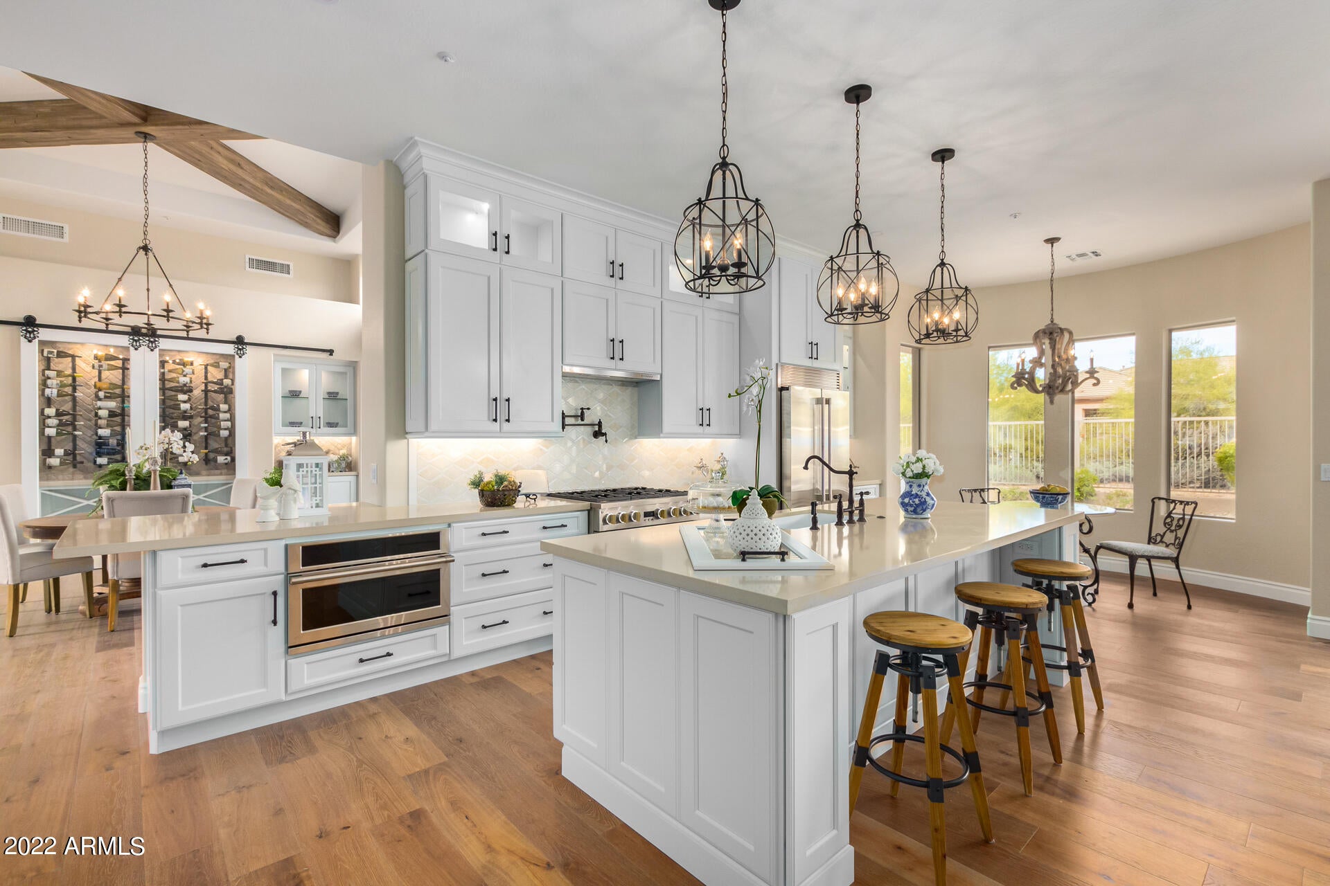 Just completed this stunning re-imagined & comprehensively remodeled home. Thoughtfully designed with quality finishes throughout this now open-concept layout has been transformed.  European white oak floors, 9' kitchen island, Monogram appliances, quartz/quartzite counters throughout & beautiful tile work in the bathrooms/laundry/backsplash. Enjoy custom wine display & ceiling beams in the great room.  Owner's suite boasts a spacious marble bathroom with free-standing tub, large shower & custom closet. Outside there's a delightful water feature, fire pit, barbecue, travertine pavers & mountain views. Roof underlayment & HVAC both replaced in 2020 along with the water heater. Terravita living at its very best.