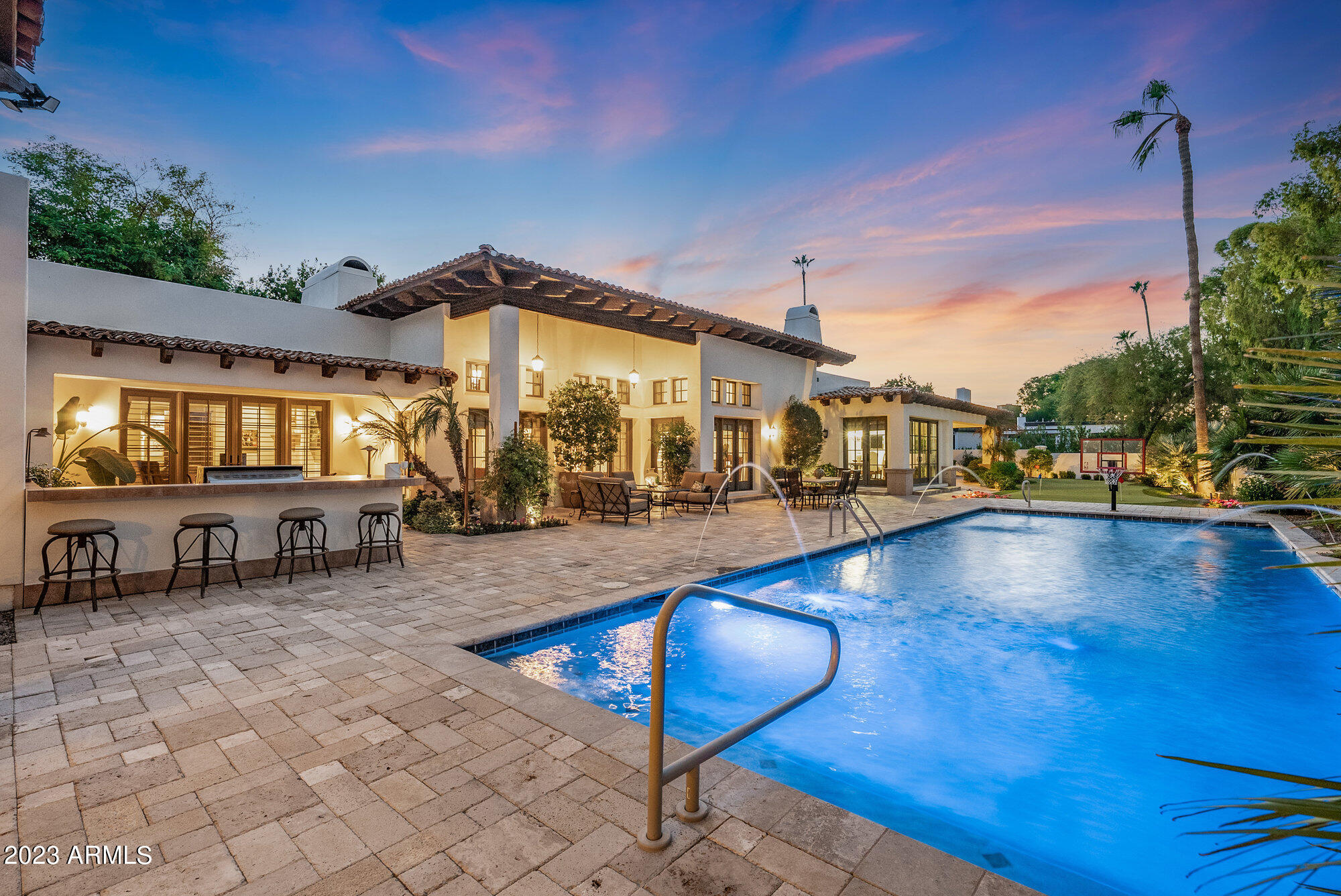 Welcome to Maverick! This beautiful single level in the coveted Camelback CC Estates has 5 ensuite bedrooms + powder room. Be captivated by the exquisite finishes & seamless connection of the living spaces all opening to the backyard for year-round enjoyment. The Primary suite has dual water closet, washer/dryer and separate Zen room or can be another closet, private outdoor jacuzzi! Office/BD5 w- private patio. The heart of the home is undoubtedly the chef's kitchen with dual islands and a serene breakfast area which overlooks the golf course and mountain peaks. Resort backyard boasts a refreshing SALTWATER pool, built in kitchen with gas grill/fridge/storage -expansive patio with addt'l ramada with electric sunscreen shade, putting green + pool bathroom & storage area. See more.. Maverick Masterpiece Additional Details:
Beautiful Courtyard entrance with Iron Gate and Water Feature.
Custom Entry Door + All Solid Core Doors t/o
All bedrooms including the office have walk in closets and all have custom built in shelving from California Closets with laundry bin.
Wood beams and ceiling detail in several main areas. 
Built in Wine Refrigeration - Kitchen
Miele Built in Coffee Machine and wet bar with refrigeration in Primary Suite.
Built in China Cabinets with beaded glass & lighting. 
Pot filler and warming drawer.
Custom drapes, custom window treatments, plantation shutters, wood security patio doors. All windows and doors are by ANDERSON WINDOWS AND DOORS.
4 NEWER AND REPLACED TRANE AC's unit- 2019, 2021, 2023.
Security system
Surround Sound t/o AV/Tech Closet
Built in garage cabinets in all 4 bays, epoxy floors, water softener system (Mr. Culligan Man)
Wet bar in office with b/i refrigeration, coffered ceiling in office. Office/5th Bedroom showcases bookshelves which are NOT attached to the wall and are freestanding. So this room is a bedroom with private patio space.
Exquisite stone fireplaces in the living room, family area and main primary suite. 
Wide plank wood floors and stone tile. 
Electronic Sun-Shade Screen at Ramada. 
Loads of closet space for everything. 
If you enjoy gardening, there is a large, raised garden bed with water auto-timer. 
Don't miss this opportunity to make this exquisite home yours. Contact us today to experience the Maverick Masterpiece for yourself. 
Your dream home awaits.