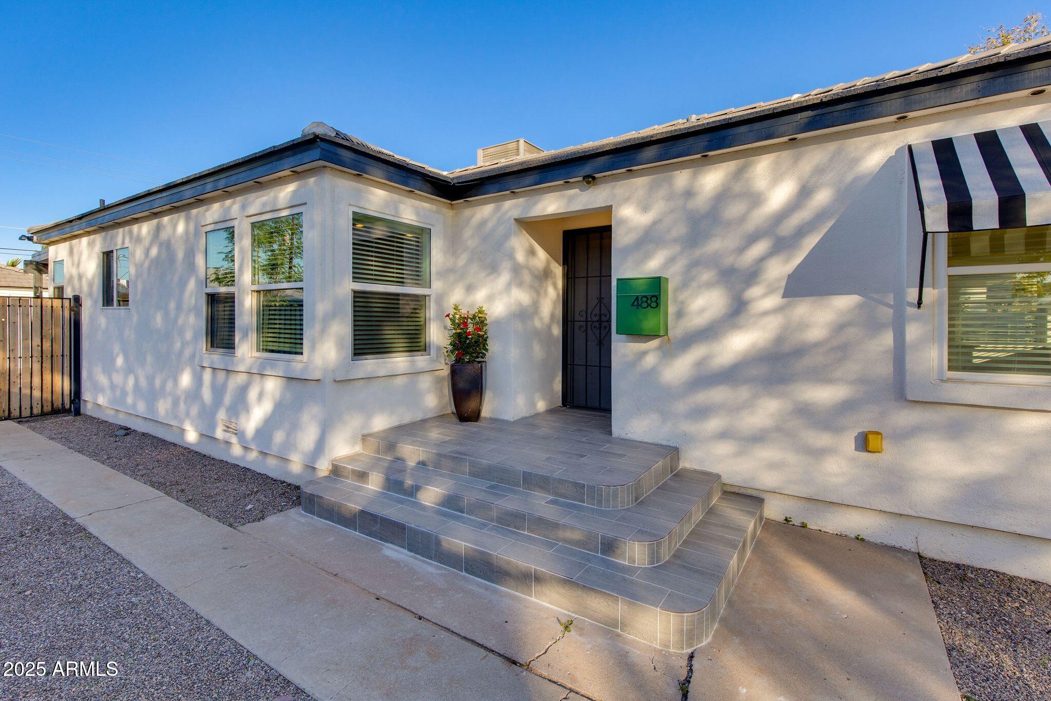 Step into timeless charm with this beautifully preserved historic bungalow in the heart of Chandler. Rich in character, the home features curved ceilings, charming built-in niches, and architectural details that reflect its classic roots. Thoughtfully paired with modern updates including new windows. Set on an 8,000-sq-ft lot and just steps from Downtown Chandler's vibrant coffee shops, restaurants, and nightlife.  Featuring 2 bedrooms, 1 bath, an updated kitchen, and lush landscaping, plus the backyard garden shed presents an exciting opportunity for a future studio or additional living space. With no HOA, this home is ideal as a primary residence or potential short-term rental in one of Chandler's most sought-after historic pockets.