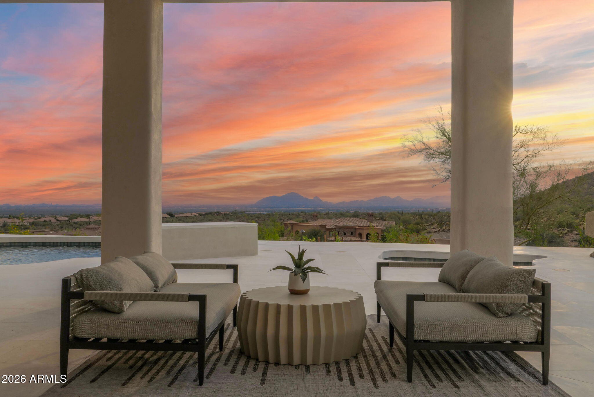 Extremely Rare highest view lot in 'The Canyons' of Scottsdale Mountain.  All new FULL 2026 Renovation done through Kozi Design.  Redesigned floor plan offing multiple living areas, formal dining, jaw dropping foyer, built in breakfast room, indoor/outdoor bar, en-suite rooms, unbelievable primary retreat with his/her massive custom closets.  Every room of this property offers unbelievable city and mountain views. The primary retreat and main living give an elevated penthouse feel overlooking the city skyline.  Massive floating stone fireplace, custom cabinets, Thermador appliances, beautiful quartzite tops and concrete walls.  Custom turkish soaking tub overlooking the city in your private master retreat. Endless covered patio and mind blowing limestone pool deck.
