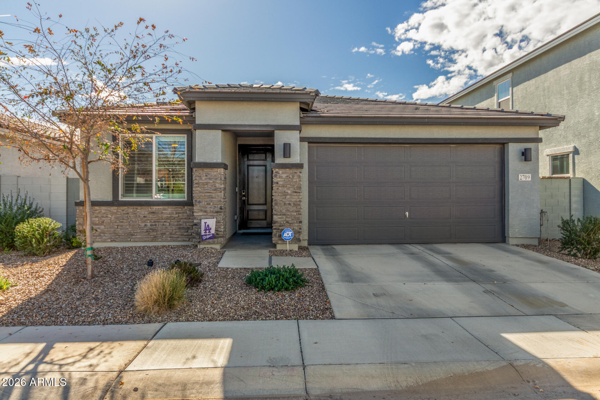 **BACK ON MARKET-Buyer couldn't perform. Thus extra days on market.

 Welcome home to this beautiful, energy-efficient home in the gated Superstition Vista! Displaying a low-care landscape, stone accent details, & a 2-car garage w/EV charging. The interior exudes sophistication with plantation shutters, designer paint, abundant natural light, recessed lighting, and wood-look tile floors w/carpet in bedrooms. You'll love the desirable great room, along with a formal dining room! The impressive kitchen boasts SS appliances, granite counters, a walk-in pantry, subway tile backsplash, white shaker cabinetry, and an island w/breakfast bar. The cozy den can be an office! The main bedroom has dual granite sinks & a walk-in closet. Check out the private backyard with a covered patio & artificial turf, where you can relax or enjoy BBQ! No neighbors behind! Just WOW