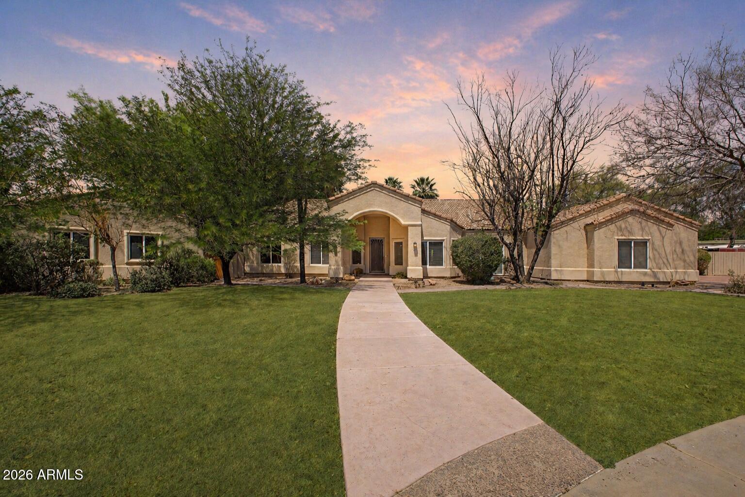 Located within the prestigious Spyglass Estates, this exceptional single-level estate sits on nearly an acre in a quiet cul-de-sac, offering a rare level of privacy. Bordering a vast open grassy area, the property enjoys an expansive, estate-like setting with no immediate intrusion--creating a truly secluded and exclusive atmosphere.
The home features a split floor plan, soaring vaulted ceilings, wood-look flooring, arched passageways, abundant natural light, and built-in speakers throughout. The chef's kitchen is upgraded with high-end appliances, custom cabinetry, granite countertops, tile backsplash, and a spacious island ideal for entertaining.
The backyard is a true resort-style oasis with a resurfaced pool, expansive grass areas, putting green, ramada, and covered patio, all design for ultimate privacy and relaxation. A detached casita provides its own living space, kitchen, and private patio--perfect for guests or multigenerational living. Additional highlights include a 3-car garage, RV storage, new roof on the main home/gazebo, New AC and new water heater in both home and casita.