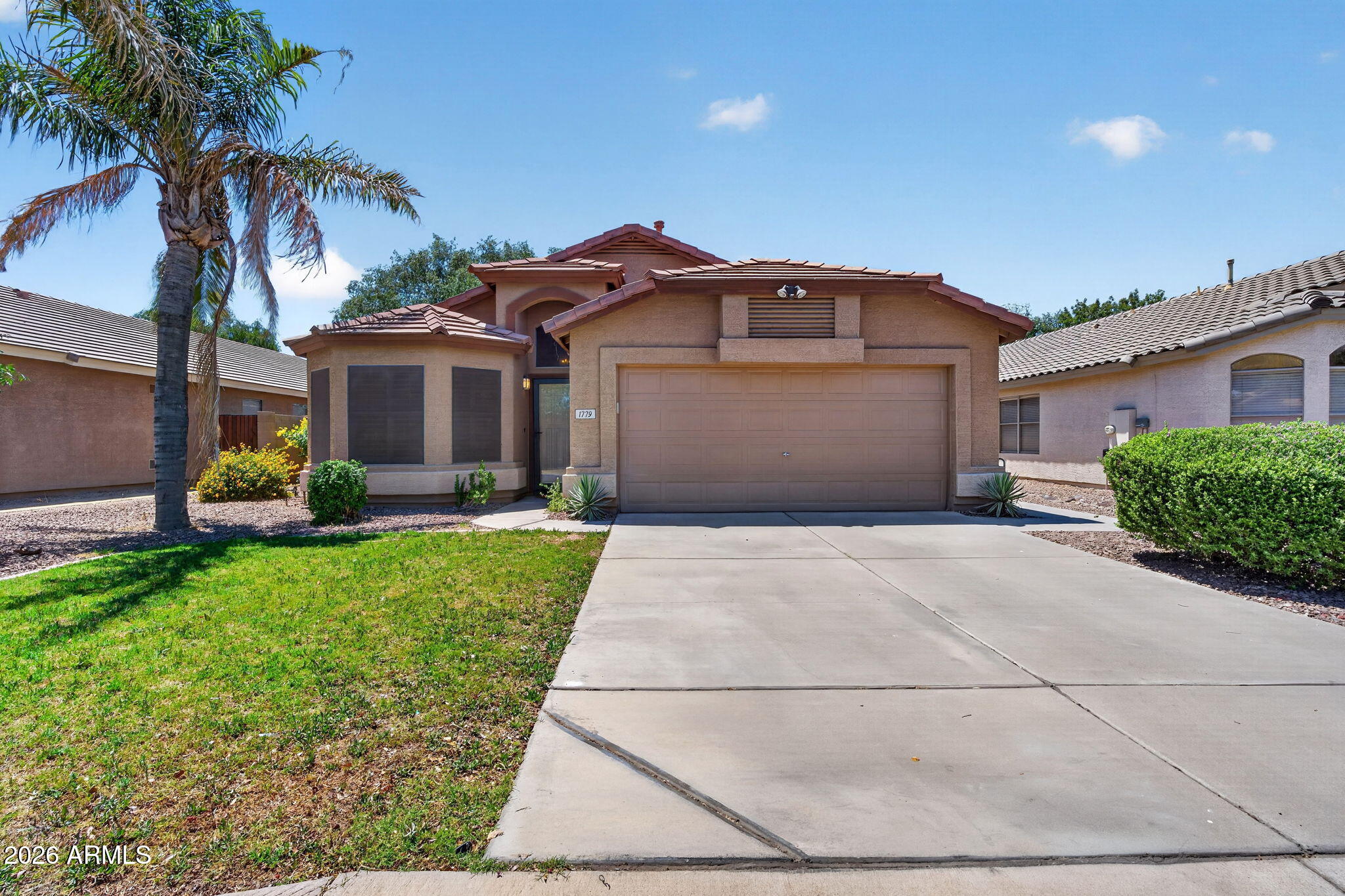 Located in the highly sought-after Gilbert Ranch community, this well-maintained single-story home offers a bright and spacious layout with soaring vaulted ceilings, separate living and family rooms, and modern neutral finishes throughout. The open kitchen features quartz countertops, stainless steel appliances, and a center island with breakfast bar, while the primary bathroom offers dual sinks and a separate tub and shower. Both the front and backyard feature low-maintenance landscaping  and the backyard is very private with no two-story homes behind and no neighbors on the east side. Prime location close to shopping, restaurants, and freeways.