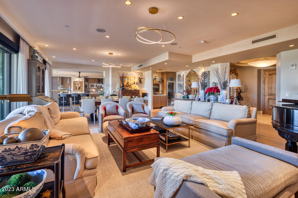 Fabulous PENTHOUSE on the TOP FLOOR at Scottsdale's premier high-rise, THE SCOTTSDALE WATERFRONT w/ BREATHTAKING VIEWS from every rm! Experience luxury living at its finest with 24 hr concierge + security. The recently remodeled 3,940 sqft PENTHOUSE boasts 3 bed,3.5 bath + library, white oak floors, limestone entry, quartzite countertops, + a bar w/ refrigerated wine storage. Chef's kitchen is equipped w/ new Sub Zero + Wolf appliances + opens to a spacious great rm + large balconies. Enjoy 5 star amenities w/ rooftop pool, huge fitness rm, massage rms, club lounge, catering kitchen, zinc bar, private wine storage, conference rm + card rm. The penthouse features 3 OF THE BEST PARKING SPACES located right off the elevators. Walking distance to over 50 restaurants + shops + trauma 1 Hospital