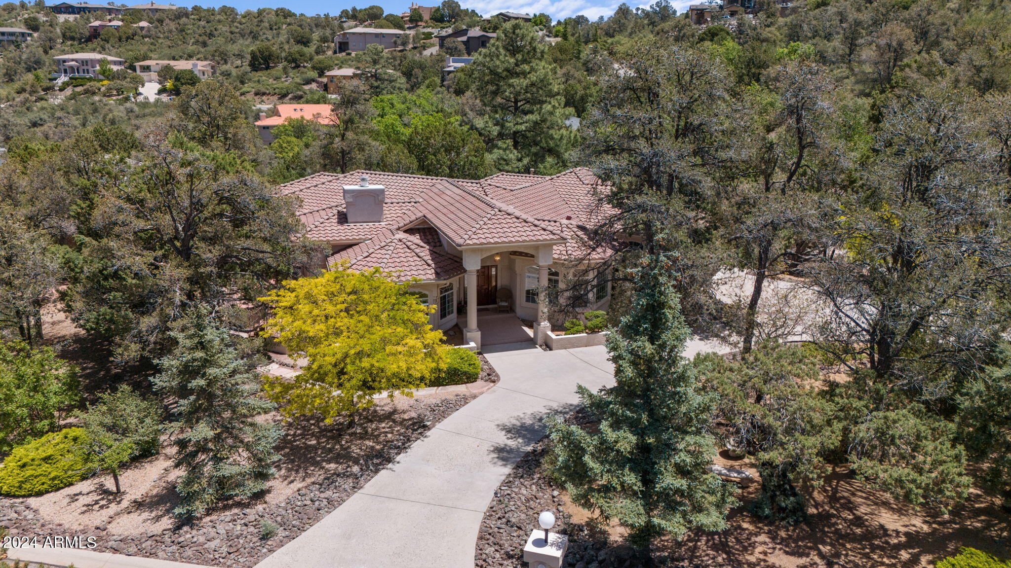 Nestled in the serene pines of the Ranch at Prescott, this charming single-level home boasts a level front lot, with Circular Driveway, ideal for Easy Living & Accessibility. The residence features an Easy Flowing, Split Floor Plan, bathed in abundant natural light throughout. With 3 bdrms, 3 baths, PLUS 2 flex rooms for a home office(s). Additionally, the 12x18 shop area is perfect for hobbyists or those in need of extra workspace or storage. Enjoy the tranquil surroundings from multiple outdoor patios and decks, perfect for relaxing afternoons or entertaining guests. Whether you're savoring the peaceful ambiance or hosting a lively gathering, this home offers the perfect blend of comfort and elegance in a picturesque setting.