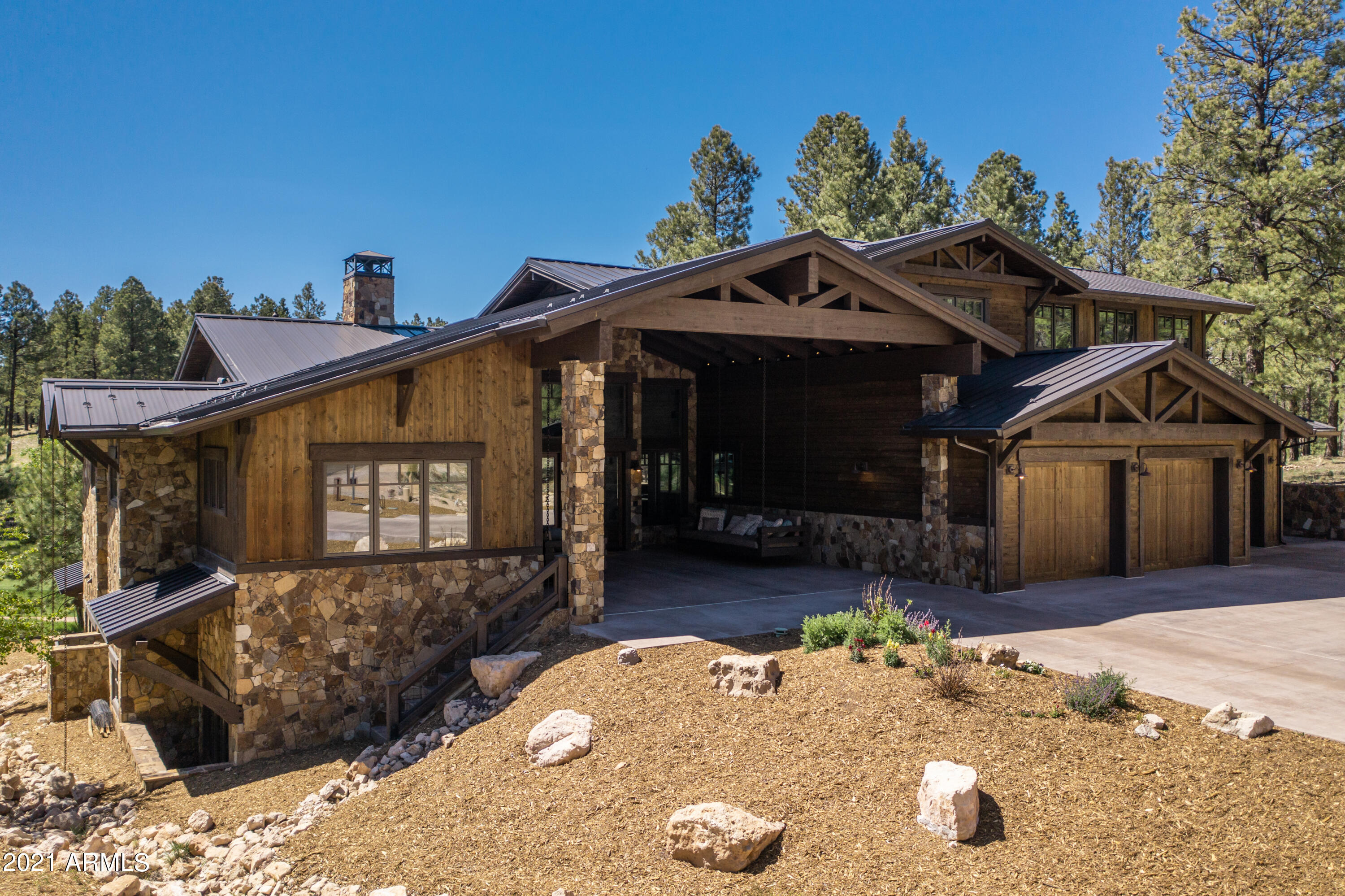 Unbelievable custom built 6 bedroom, 6.5 bathroom home with walkout basement, great room, game room, casita, & 3 car garage.  With exceptional San Francisco Peaks & forest views, & room for everyone, this mountain retreat is like no other.  The chef's kitchen boasts a SubZero 48'' SS refrigerator & 24'' wine cooler, ice machine, Wolf 48'' SS double oven & gas range, drawer microwave, 2 Bosch dishwashers, soft close cabinet doors/drawers, & huge island.  The great room features a 72'' natural gas fireplace, 19' vaulted T&G wood ceiling & beams & 16' sliding glass doors.  The owner's suite has a steam shower & access to the 74' covered patio with Trex Decking.  Entertaining made easy with custom porch swings, 42' SS Wolf Natural Gas BBQ & SubZero refrigerator.  Too cold to be outside... move the fun inside to the game room located on the lower level featuring custom wood beams and a 16' wide sliding glass door.  Built in surround sound with subwoofers in the great room & game room, interior & exterior ceiling speakers, intercom system, custom cabinets, shelving, & bunk room with stairs to upper levels, trundle beds & built in drawers.  3 car garage with mechanical storage room & full wall storage cabinets. Attached casita has 1 bedroom, bathroom, full kitchen, & living room.  All of this and so much more!  Check out the full features list attached.  This truly is a one of a kind home you must see to believe!