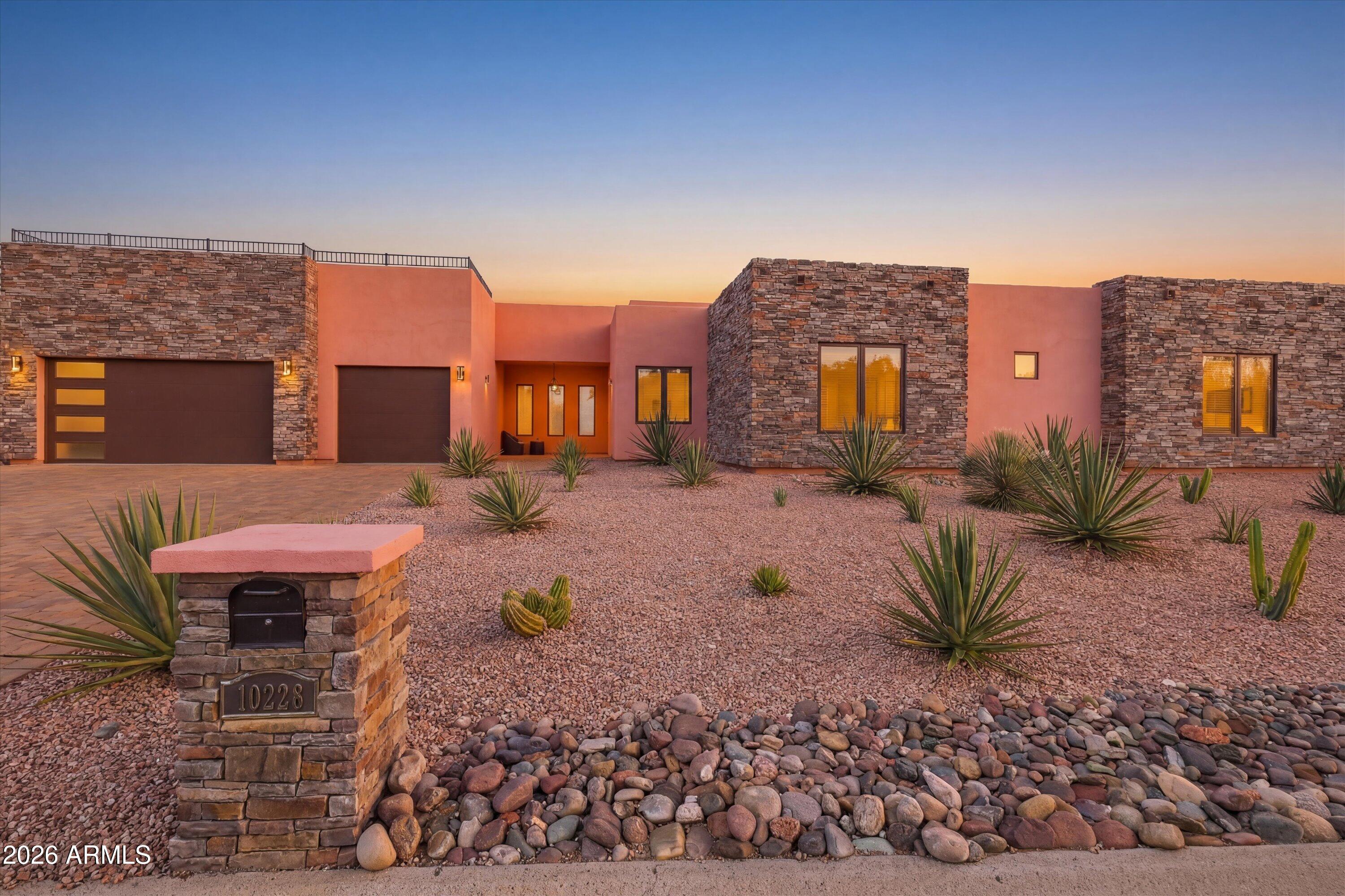 Modern desert luxury beautifully designed single-level home in the heart of Fountain Hills. Built in 2021, this 4bed/3bath residence offers nearly 2,500 square feet of thoughtfully curated living space w/breathtaking mnt views & seamless indoor-outdoor living. A stunning chef's kitchen featuring natural wood Shaker cabinetry, stainless CafÃ© Series SS appliances, built-in refrigerator, electric cooktop, wall oven, oversized island, & walk-in pantry. The open great room showcases engineered hardwood flooring, a custom built-in entertainment center with electric fireplace, wet bar, and refrigerated wine room; perfect for entertaining or relaxing in style. Expansive 12ft folding glass patio doors open to a resort-style backyard complete with a heated PebbleTec pool, Baja shelf, water feature,
