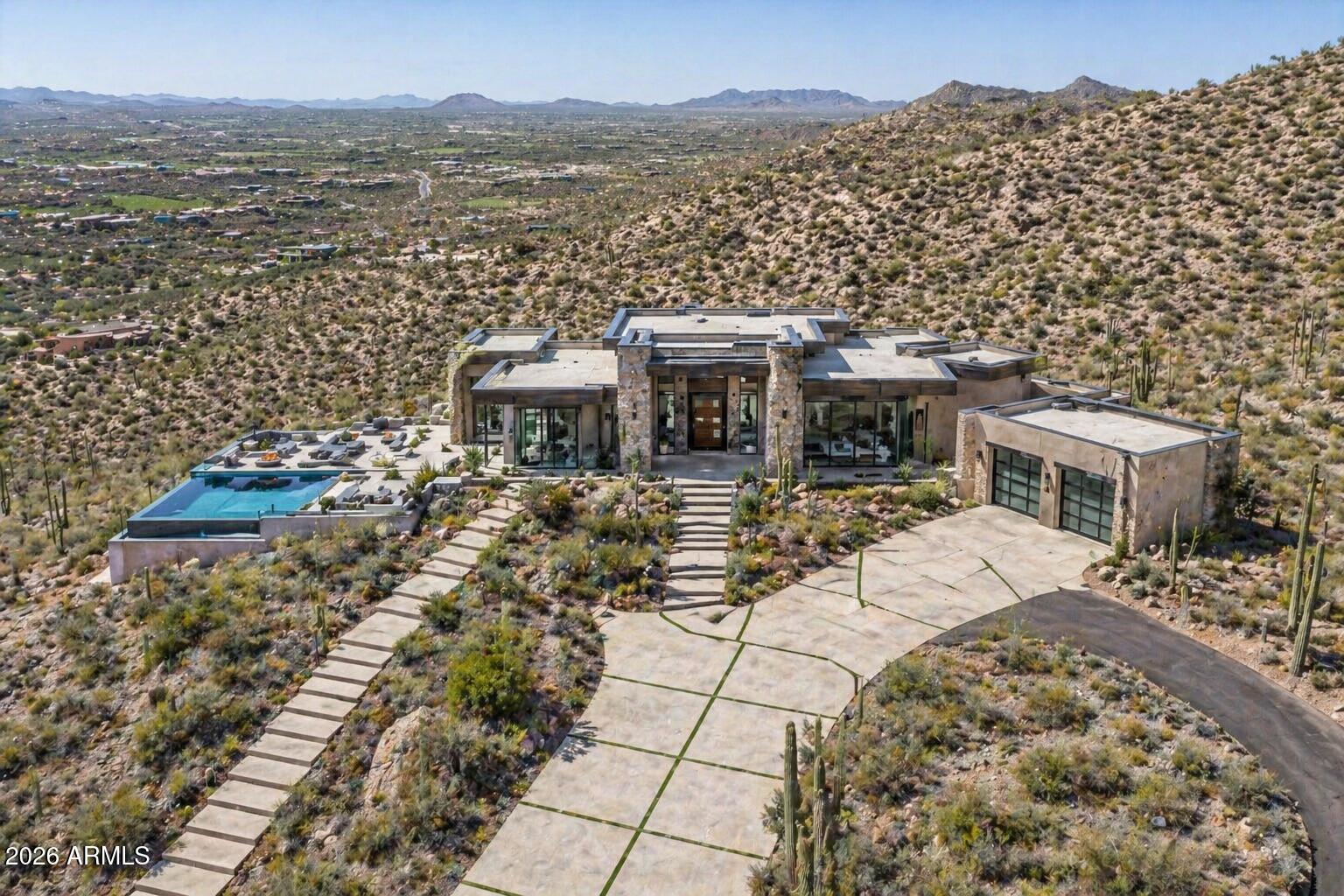 Ultimate Estate Parcel offering breathtaking panoramic views of surrounding mountain ranges, shimmering city lights, and the world-class golf courses of Desert Mountain (Chiricahua, Apache, and Geronimo). From your future custom home, frame iconic vistas of Continental Mountain, Four Peaks, the Superstitions, Weaver's Needle, Pinnacle Peak, Apache Peak, and the McDowells.

Perched at approximately 3,200 feet, this homesite delivers cooler summer temperatures, spectacular night skies, and an unmatched sense of elevation and privacy. Located within Carefree Homesteads, enjoy a relaxed yet prestigious setting with access to horse corrals, hiking trails, and expansive open space.

Paved road access with water and power just yards from the lot line--ready for a truly exceptional build.