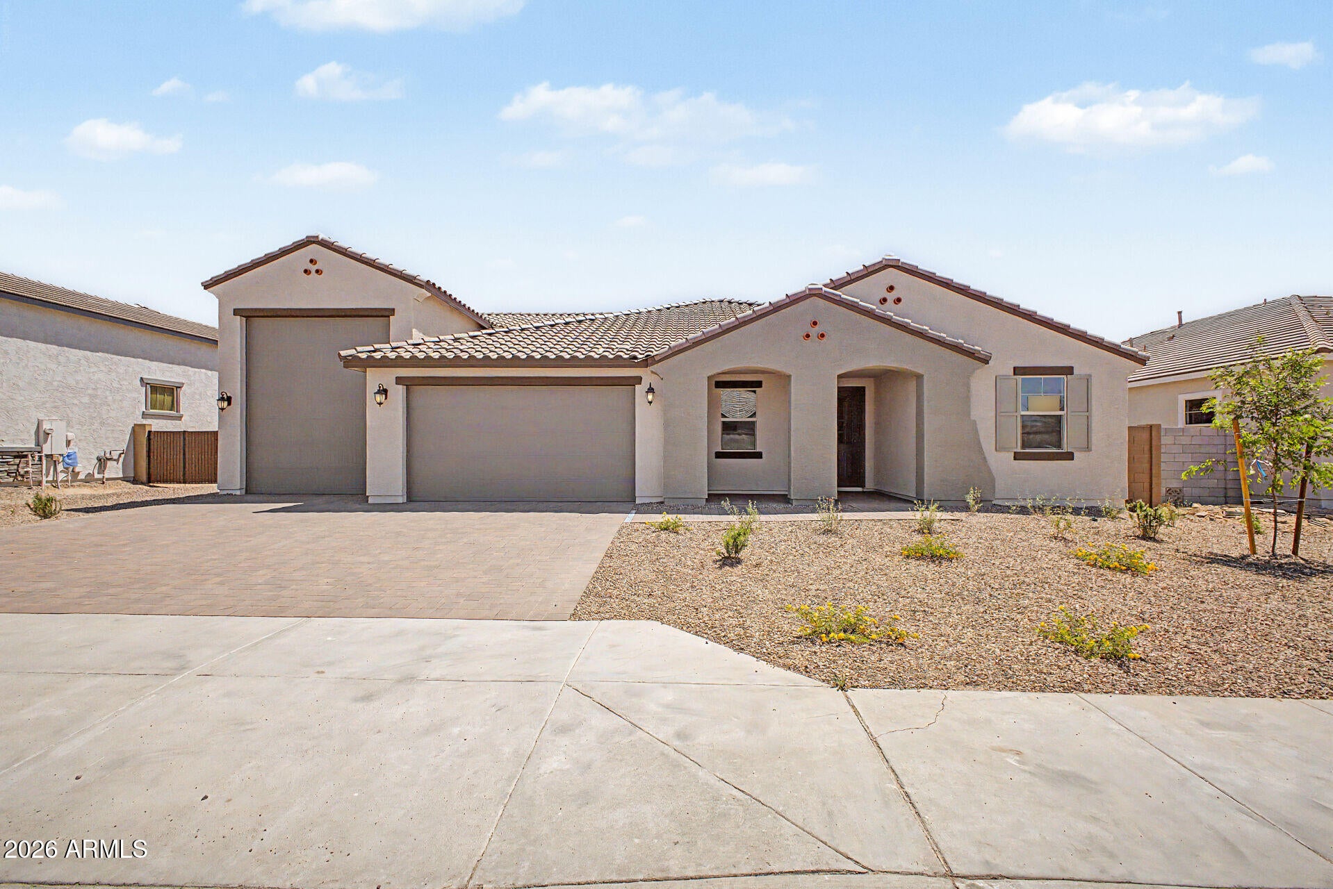 BRAND NEW, 45' RV GARAGE + 3 CAR GARAGE, BIG BACKYARD, NO REAR NEIGHBORS. Home price reflects base price with selected options. Gorgeous Interior Finishes, RV Garage + 3 Car Tandem, Pavered Driveway and Walkway, Gas Gourmet Kitchen, Oversized Bedrooms, Raised Height Vanities at Bathrooms. Las Ventanas offers homeowners convenient access to shopping, dining, recreation, and major employment centers. Easy access to Interstate 10 and Loop 303 ensures a seamless commute. Residents can enjoy a centralized park with EV Chargers, shaded play structures, sports courts, outdoor amphitheater and a large, covered open air pavilion that includes picnic tables, lawn and table games, comfy lounging areas and open turf areas--perfect for outdoor enthusiasts.