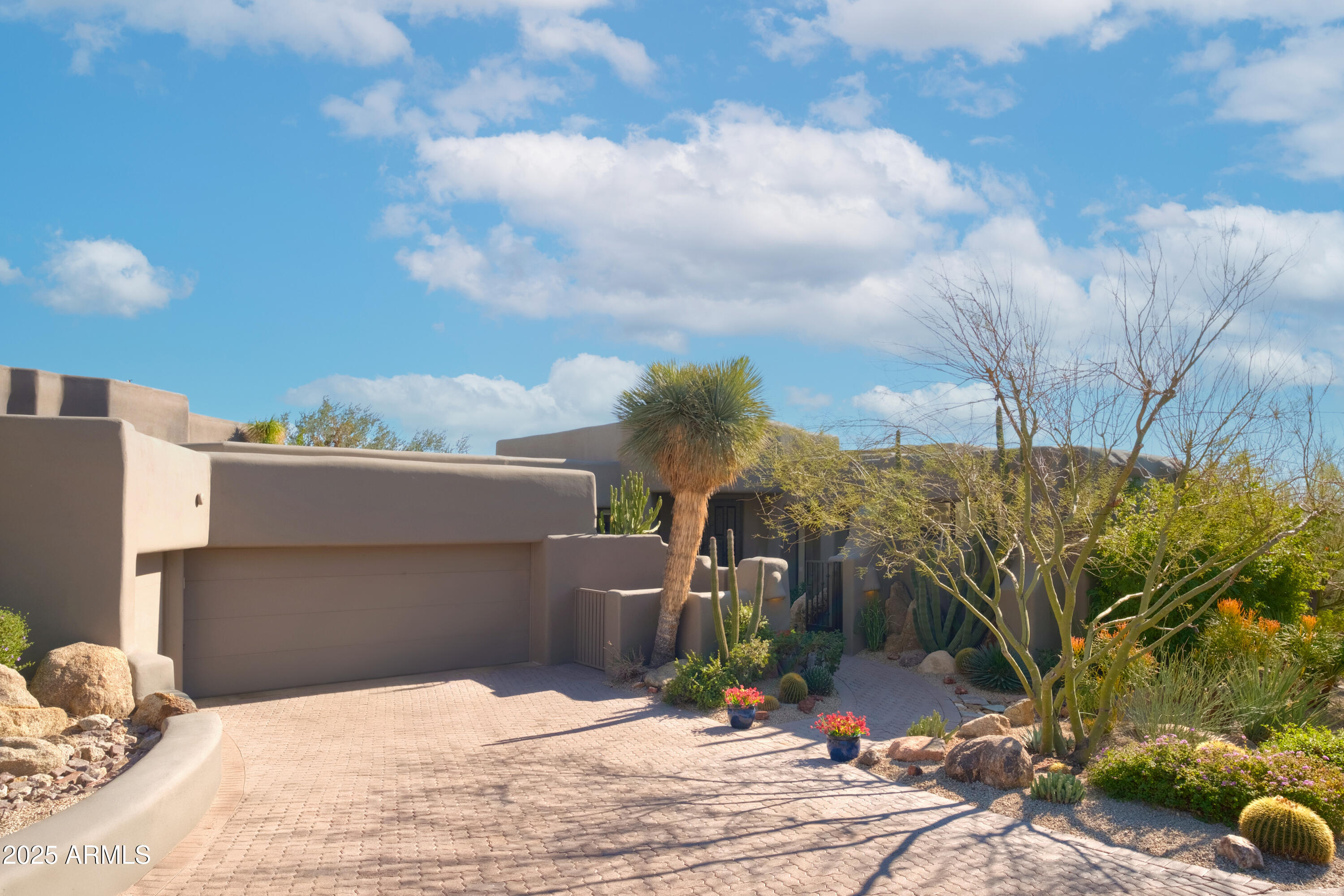 Rare, single level Hillside Villas home, nestled at the base of Pinnacle Peak in the desirable Desert Highlands Golf Course Community. This exceptional property features an expansive floor plan, beautifully redesigned with multiple sets of Panoramic Doors opening onto the 16th green, Troon Mountain and beyond.
Superior craftsmanship seamlessly integrates high end finishes with comfort and purpose, providing an exceptional indoor/outdoor living experience. The heart of the home boasts expansive ceilings and an abundance of natural light. Wide open floor plan features multiple living and dining areas, gourmet kitchen with high-end appliances, custom cabinetry, multiple wine chillers and several oversized islands. The secluded primary retreat with fireplace is spacious, boasting its own separate patio with yet another fireplace steps away from the Pool and Spa.
Luxurious primary bath thoughtfully designed with 2 separate vanities, large shower, soaking tub and 2 custom closets. The oversized 3-car garage with extensive cabinetry provides an amazing amount of storage space and the separate workshop is an added bonus! This home has been meticulously maintained and offers so many impressive features! Owners are here only 3 months a year, so very lightly lived in. Turn-key, Move-in Ready.
Casita plans at 3rd car garage available for viewing. Close escrow today and play golf tomorrow on the Jack Nicklaus Signature Golf Course!  This wonderful community offers an 18 hole putting course, Restaurants (Ventana & Jack's), Fitness center, heated lap pool, tennis, pickleball, bocce, walking trails, social clubs, and gated security.