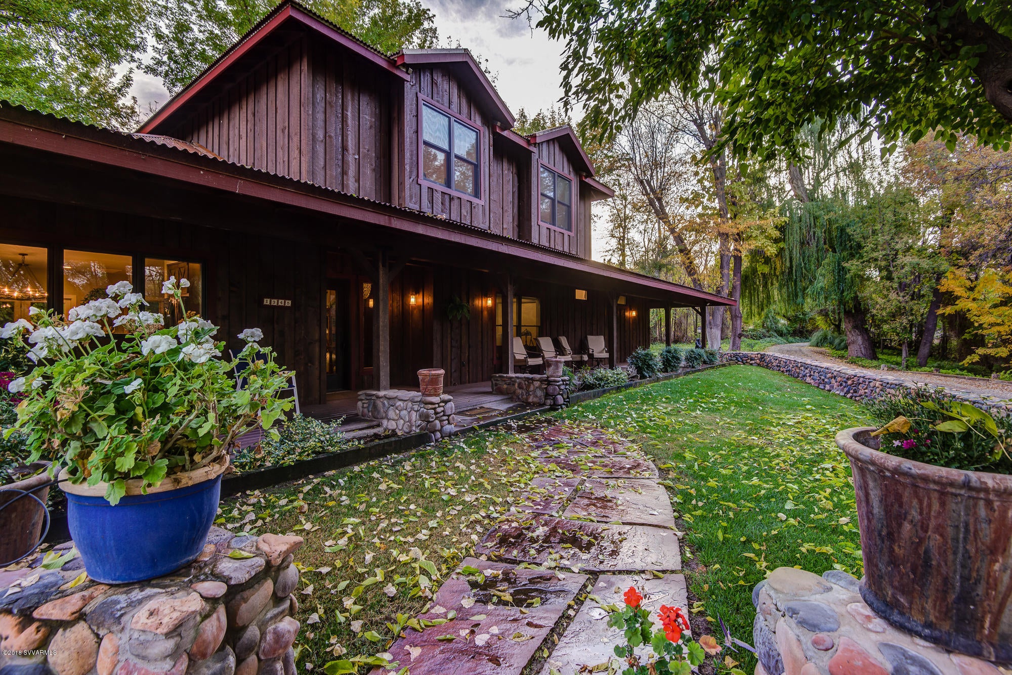 Spectacular 10+ Acre property above the banks of the Oak Creek with over 300 Ft of private creek frontage, mature trees, fruit trees, irrigated grass pasture and so much more. This is your own private oasis. The main house was remodeled in 2015, creating over 3,000 SQ FT. Downstairs are 2 beds, 2 baths, and the main living quarters. Up the custom staircase is a second living area with 2 beds, and 1 bath. All the finishes are of the highest quality. The rough sawn pine exterior carries over to the 2,100+ Sq Ft Garage with an additional 1,475 Sq Ft bonus room above. New drywall is installed. Make this an office, game room, trophy room, hobby room or any other use. There is a deck with views of the pasture off of the upstairs room. This is a 1 of a kind resort like property.