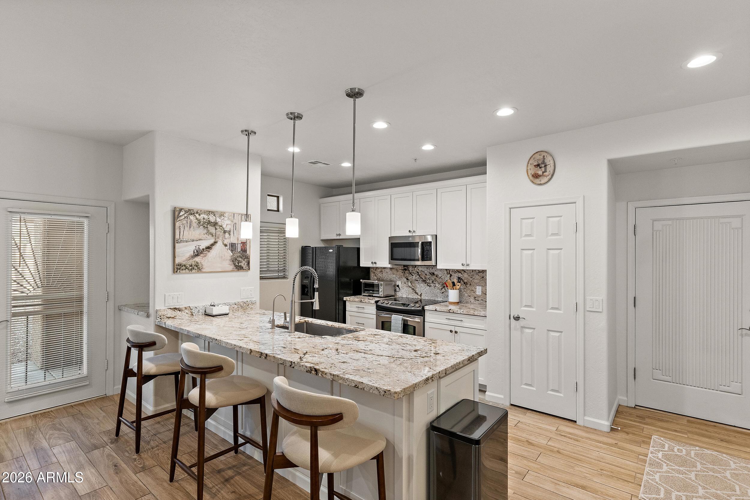 Experience resort-style living in North Scottsdale with this beautifully remodeled 2 bed 2 bath ground-level condo in the gated community of Mirage Crossing. Feel right at home in this turn-key condo featuring a refreshed, open layout with a seamless flow between the kitchen, living, and dining area-perfect for relaxing or entertaining. Additional upgrades include tankless water heater & water softener. Enjoy the community amenities including a large pool, spa, fitness center, clubhouse, BBQs & lush green spaces. Ideally located near top shopping, dining, golf, and hiking, this condo offers the perfect blend of lifestyle, comfort, and convenience. Perfectly suited as a second home, income-producing rental, or full-time residence. Don't miss your chance to own this Scottsdale retreat!