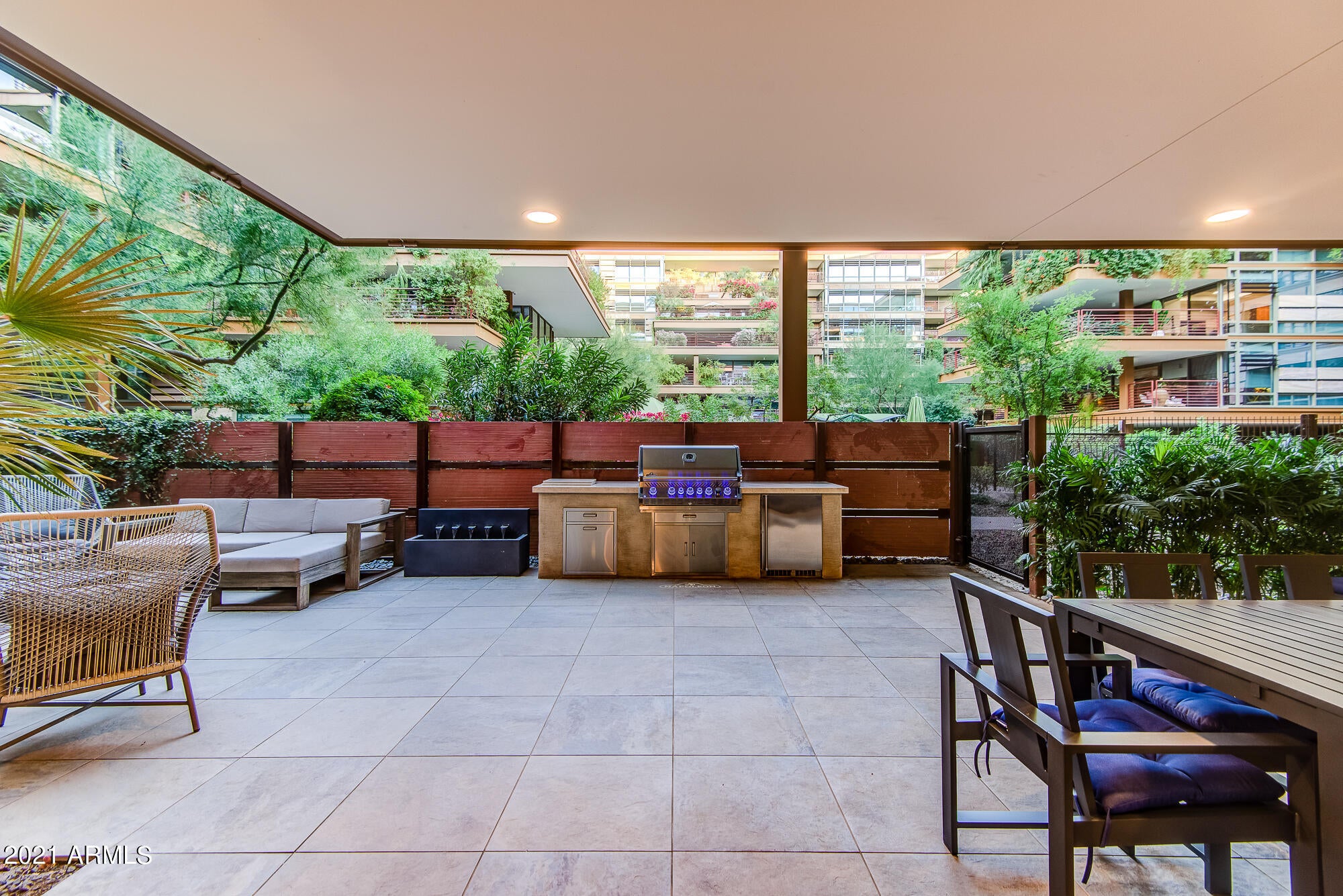 Welcome to this extremely rare Optima Camelview private casita (only 8 exist in all of Optima).  Featuring direct private access through the front and back (no shared walls!).  This spectacular one of a kind unit just completed a massive 9 month complete interior and patio luxury renovation. Boasting a 1500+sqft patio (one of the largest in all of Optima), this patio features a piped in natural gas fire pit, massive bbq area, fountain, both covered/uncovered areas and endless space for relaxing and entertaining.  The interior offers a wonderful split open floor plan with kitchen & dining featuring Wolf & Sub zero appliances & a fully stocked floor to ceiling 300+ bottle glass wine cellar.  The living room looks out to the lush patio and features a gorgeous fireplace accent wall. The master suite's entire back wall has floor to ceiling glass with spectacular views of the terrace.  Like the living it features another fire place but with water falling custom black quartz on both sides.  Both bathrooms feature custom accent walls, custom push to open cabinetry and breathtaking shower tile work.  

The entire condo has custom Control 4 integration with 16 speakers throughout.  This is controlled with either the in wall Ipad or your Iphone.  This smart home also fully controls the lights, fire places, automated shades and nest thermostats.

You will not find a condominium as customized as this one.  All found within the luxurious Optima Camelview Village with it's incredible amenities and unbeatable location.