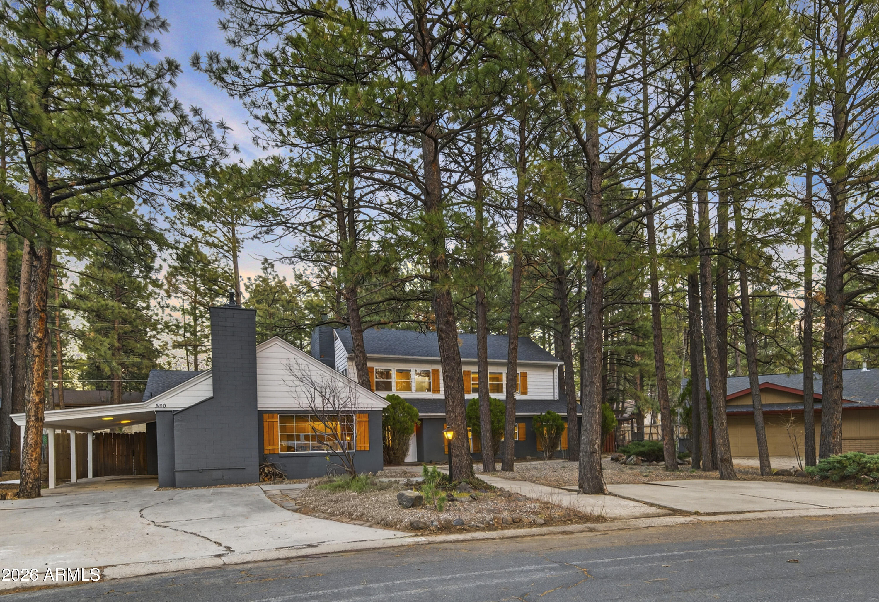 RARE CHERRY HILL OPPORTUNITY. Discover the perfect blend of historic character and modern luxury in this 6-bedroom 4-bathroom mountain retreat. Nestled among ponderosa pines just steps from Downtown Flagstaff, Wheeler Park, and the Urban Trail system, this home offers the ultimate mountain lifestyle.
MODERN UPDATES: Features updated flooring, designer lighting, updated cabinetry, and refreshed baths. The timeless soul of the home remains through the charming stained glass and 3 cozy fireplaces.
DUAL-LIVING POTENTIAL: The upper level boasts a private MOTHER-IN-LAW SUITE with its own interior/exterior entrance, a updated kitchen, and a private patio. Whether you need a multi-generational setup, a premium 2nd home, an investment property, this layout delivers something for every buyer.