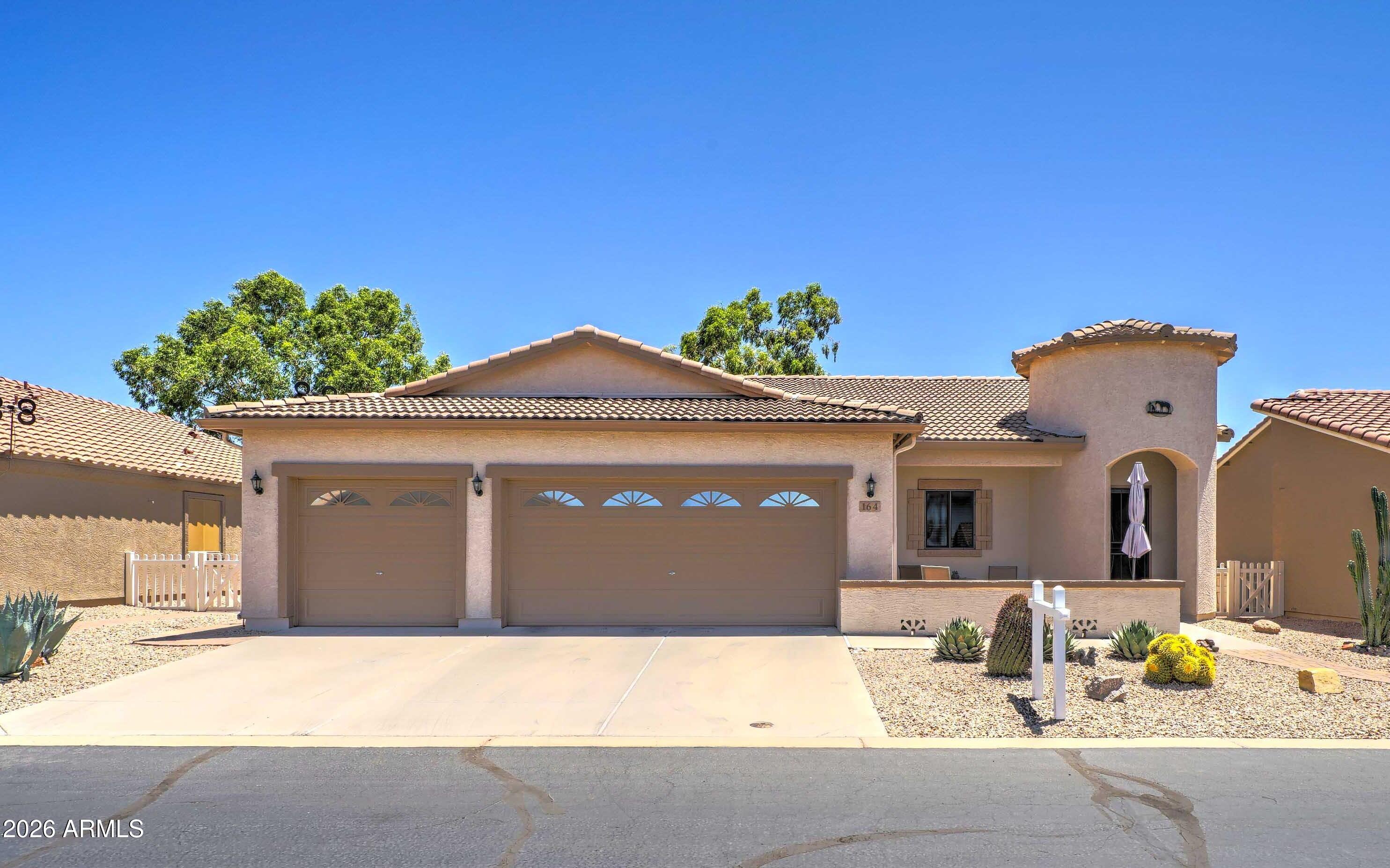 Beautifully maintained, move-in ready home in Meridian Manor featuring 2 bedrooms, a den with double doors, and 2 baths, including a remodeled primary shower and a secondary bath with cast-iron tub, porcelain tile, and granite vanity. The bright great-room layout offers formal dining space, and the chef's kitchen showcases a large granite island, stainless appliances, and upgraded cabinetry. Ceramic tile, plush bedroom carpet, ceiling fans, and a newer water heater add comfort. Enjoy mountain views from the extended paver patio. Community amenities include pool, hot tub, pickleball, bocce, putting green, clubhouse events, gym, library, billiards, and arts and crafts. Rare 3-car-garage home in a desirable 55+ community.