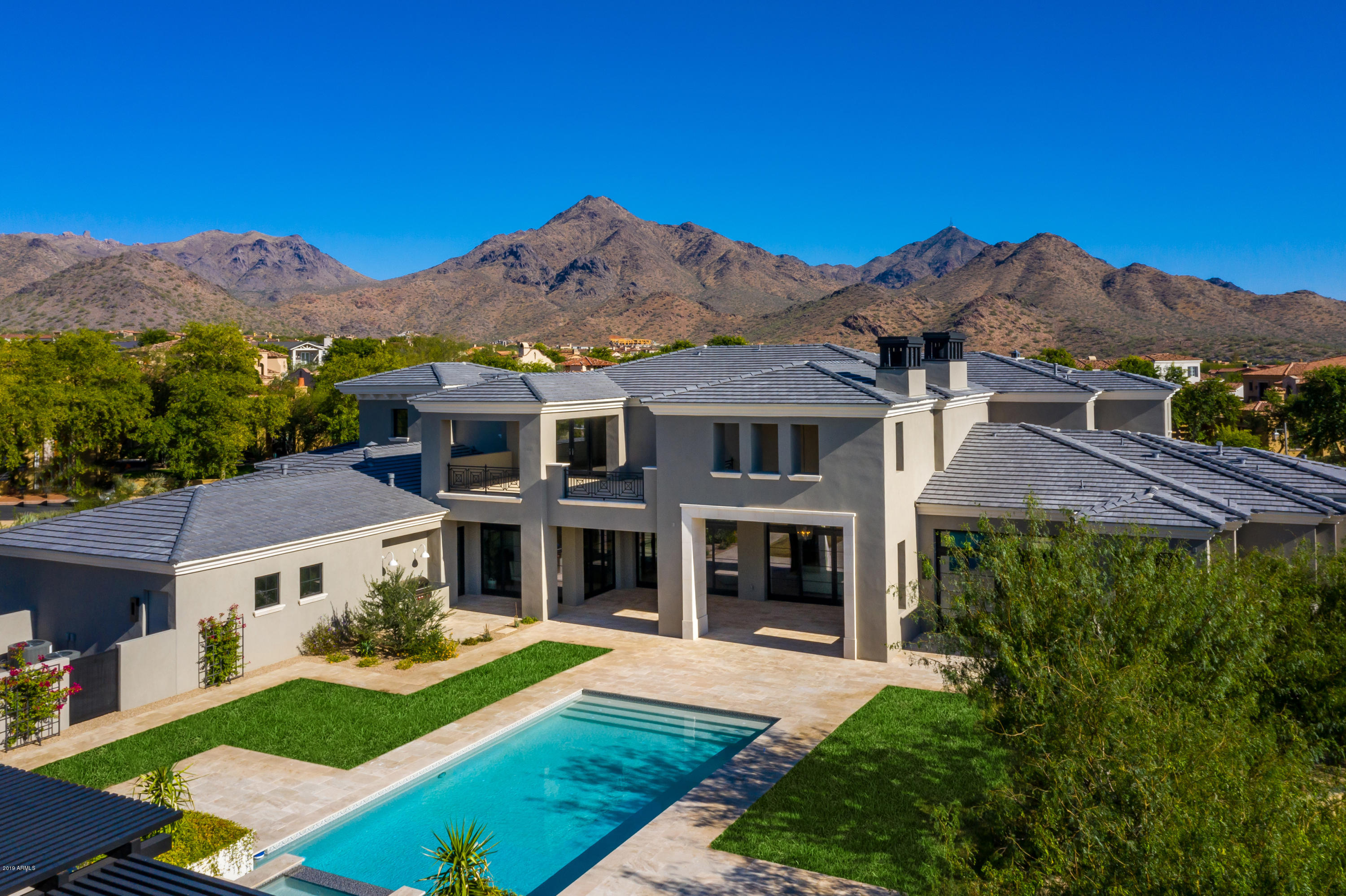 The Arcadia neighborhood in Silverleaf is one of the most sought after locations in the Valley and this newly constructed stunner is one not to be missed. The team of GCW Builders and Katie Bowe Design thoughtfully crafted this 7,500+ square foot, 5 bedroom (plus office) and 6 bath Modern Mediterranean style estate, with high quality finishes and a design style that is sophisticated yet casual. The great room floor plan seamlessly opens to one of the largest lots in the neighborhood, for that desired indoor/outdoor living that is perfect for both family living and entertaining. The main level guest casita with kitchenette, walk in closet, and full bath is ideal for those special guests, and the large four car garage affords plenty of space for the toys! This is one that must be seen!