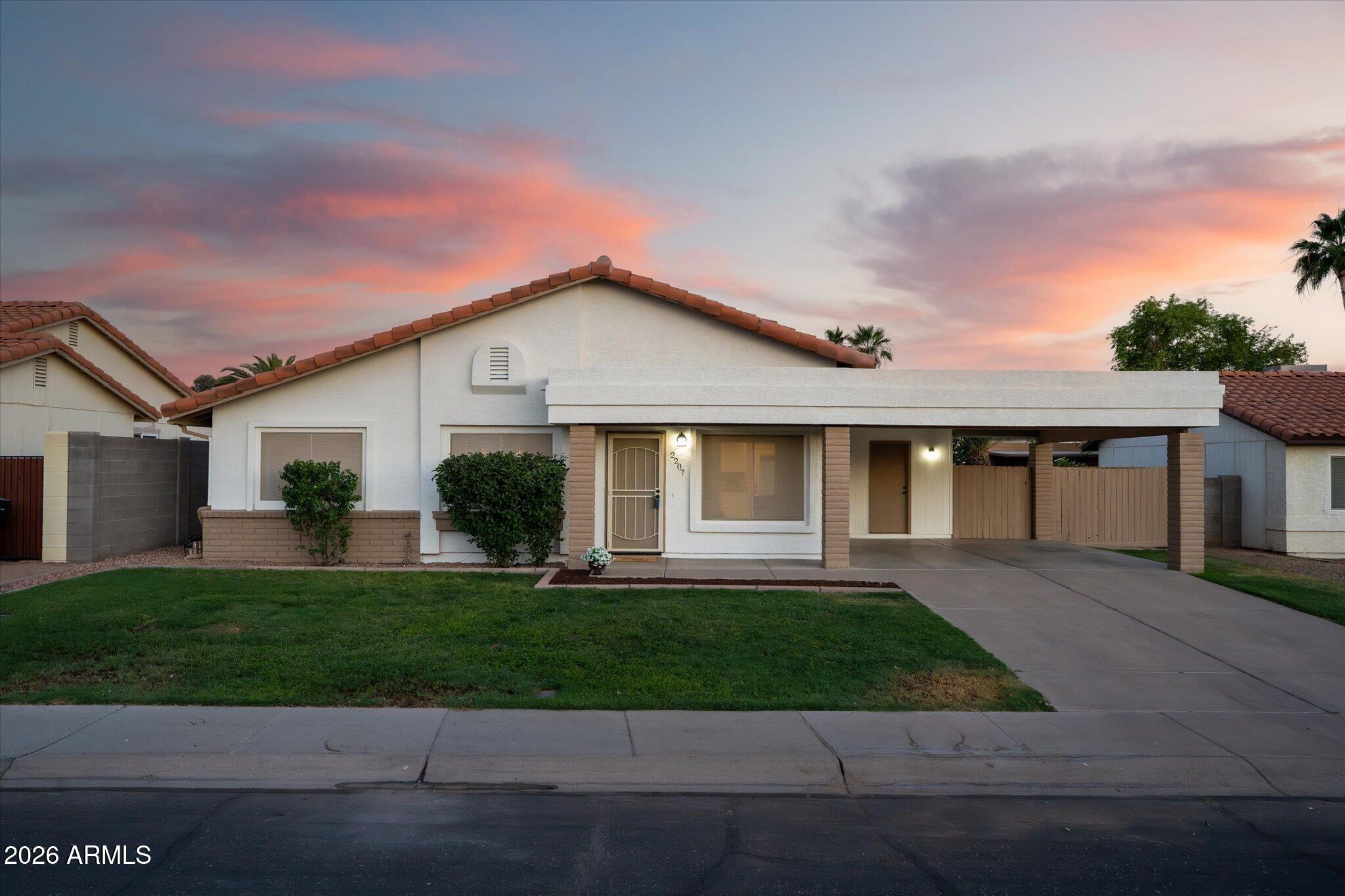 Affordable living meets convenience and desirable location with no HOA! Nestled in a quiet and well-kept neighborhood, this charming home offers exceptional value with easy access to shopping, dining, and entertainment. Additionally located in the highly coveted Chandler Traditional Academy district and just minutes away from Highway 101! Inside, you'll find tasteful upgrades including flooring, white shaker cabinetry, granite countertops, kitchen sink, upgraded vanities and lighting in both bathrooms, master bathroom shower flooring replaced, new tile flooring in hall bath, R-30 insulation blown into attic significantly improving energy efficiency, roof underlayment replaced, and carport roof replaced. 2026 improvements include exterior paint and brand new fence on the east side. The oversized backyard offers endless possibilities such as adding a pool, hosting a bbq, gardening, or customized landscaping projects. A rare opportunity to own an updated Chandler home with a premiere location and affordability all in one package!