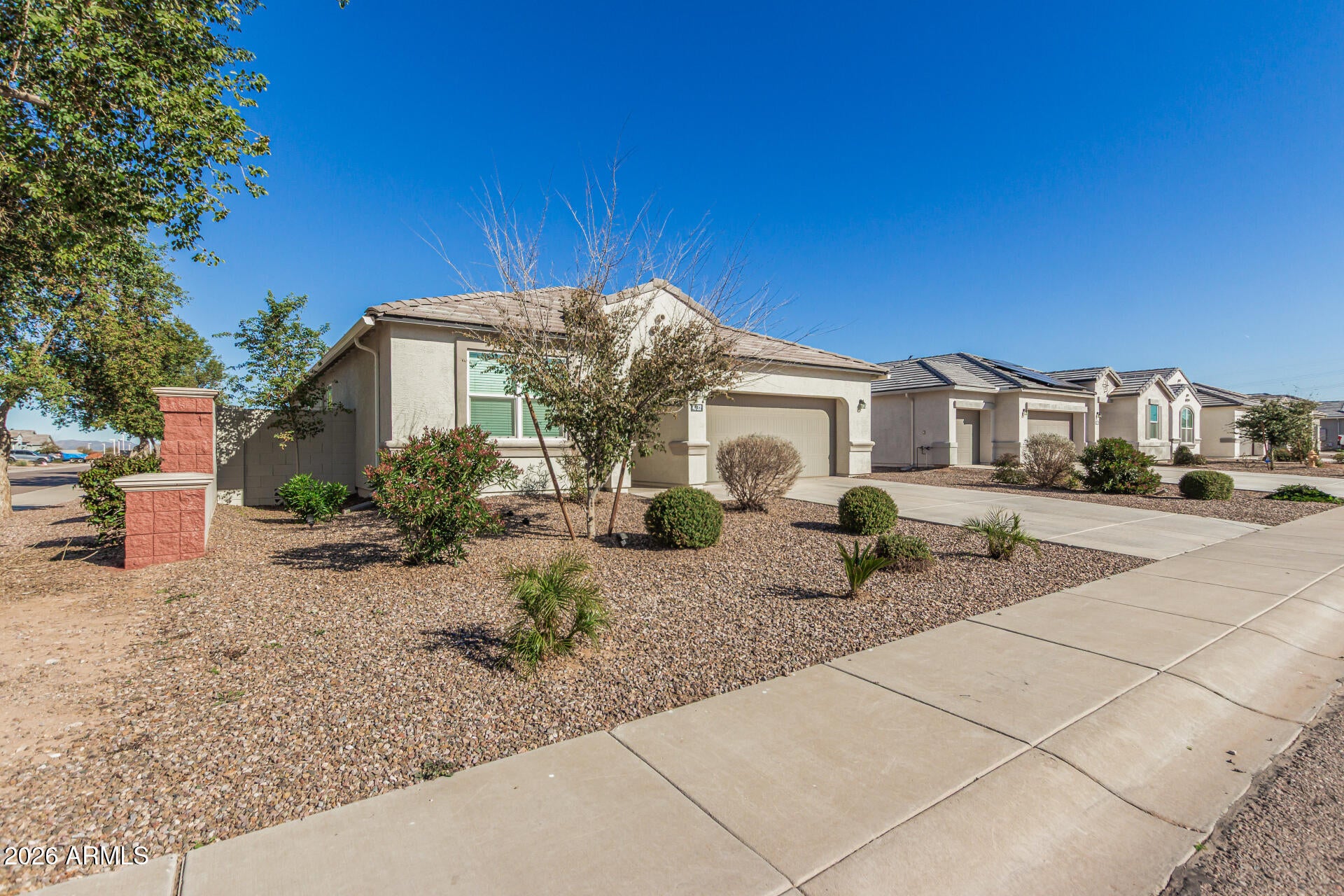 Quick Possession!!! Amazing 5-bedrooms 3 Bathrooms single story home 2 Car Garage on a corner lot! A well-maintained front yard with an extended gravel driveway that leads to double gates through the backyard. A covered porch leads to the front door and opens to a foyer entry. High ceilings, recessed lighting and a soothing palette run throughout accented with stylish fans and fixtures. The kitchen comes with granite counters, wood cabinetry, stainless steel appliances, a walk-in pantry and an island with a breakfast bar. The primary bedroom showcases plush carpeting, an ensuite with double sinks, and a walk-in closet. The backyard offers a covered patio and low maintenance landscaping. Close to freeway access. Come and see!