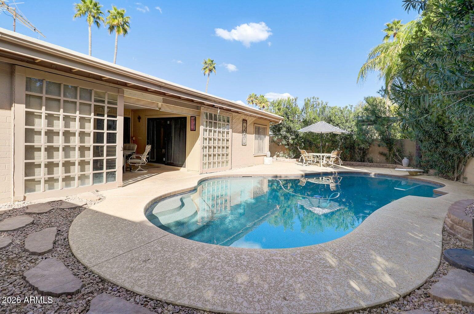 An exceptional opportunity awaits in one of Scottsdale's most coveted locations--where fully renovated homes in the neighborhood are commanding $1.5M+. This property offers the rare chance to create immediate equity while designing your dream home in the heart of the Gainey Ranch and McCormick Ranch corridor. Surrounded by miles of scenic walking and biking paths, championship golf courses, upscale shopping, and top-tier dining, this home places you right in the center of Scottsdale's premier lifestyle. Built by renowned Pennington, the residence showcases timeless Scottsdale architecture and sits on a desirable north/south-facing lot, complete with a sparkling pebble-tech diving pool--perfect for enjoying sunny Arizona days year-round. Inside, the light-filled floorplan is thoughtfully designed around a private outdoor atrium, creating a seamless indoor-outdoor feel while filling the home with natural light. The updated kitchen offers a great starting point, while the rest of the home presents an incredible opportunity to customize and elevate the space to your personal style.

The spacious primary suite serves as a private retreat, featuring a flexible sitting area or home office, along with a spa-inspired bathroom complete with a steam shower. A versatile family room with a wet bar is currently being utilized as a fourth bedroom, offering flexibility to suit your needs. With the announcement of the new 'Lakefront at Scottsdale' this location will surely become even more appealing in the future. 
Notice the huge R/V Gate leading into the side yard!  A lot of room for your toys. 
This is your chance to secure a home with upside and potential in a premier Scottsdale location--don't miss it.