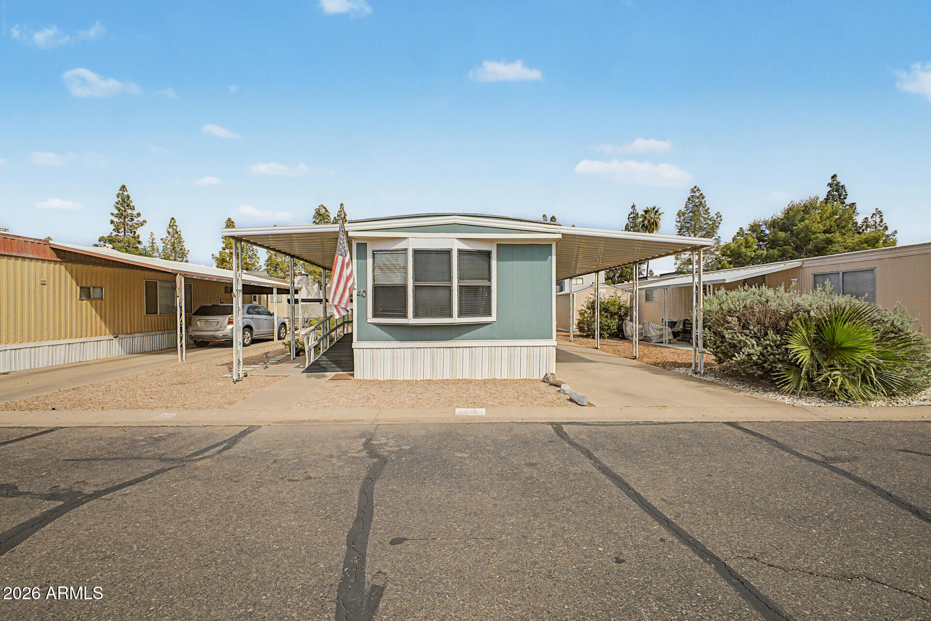 Welcome home! This charming 3-bedroom, 2-bath mobile home greets you with an attached carport and an access ramp for convenience. Discover an appealing open layout with a warm palette, blinds, and wood-look flooring. The kitchen comes with ample cabinetry and essential built-in appliances for a seamless cooking experience. The main bedroom includes a private bathroom for added comfort. You'll also find an outdoor shed for additional storage. Conveniently located close to bus stops, restaurants, and shopping. Don't miss out on this one!