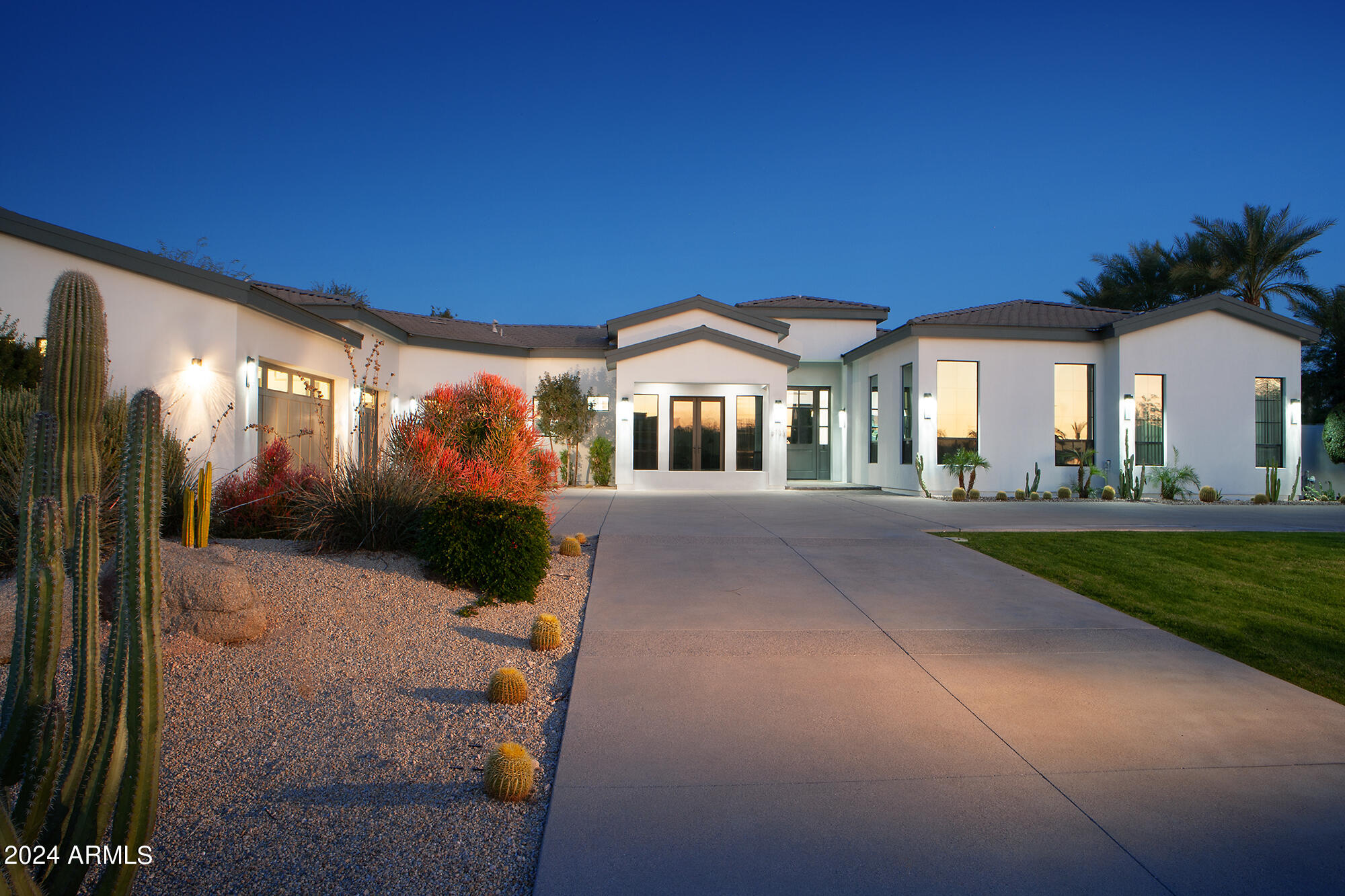 Welcome to an unparalleled modern masterpiece nestled on one of Paradise Valley's most coveted private streets. This exquisite residence boasts a luxurious lifestyle with meticulously curated features and stunning Camelback views that will captivate the most discerning homebuyer.
As you step into this warm and inviting home, a culinary haven awaits in the gourmet kitchen featuring a Wolf 6-burner gas cooktop, double ovens, a microwave, and  SubZero® refrigerator/freezer. The kitchen is a chef's dream with not one, but (2) dishwashers, ensuring seamless functionality and convenience.
Natural light bathes every corner of this residence, creating an ambiance of serenity and openness. The living spaces seamlessly flow through the inviting wall of glass that leads to an enchanting patio overlooking the updated pool. The pool area is a retreat in itself, complete with a sunken gazebo and an outdoor kitchen featuring poolside swim-up seatingan idyllic setting for entertaining guests or enjoying tranquil evenings.
This home encompasses four bedrooms, each an oasis of comfort, and six baths exuding modern elegance. A large media/game room provides a space for recreation, while an office/study is designed for the most deserving executive seeking a private workspace.
For the wine connoisseur, a temperature-controlled wine room with space for over 600 bottles becomes a dramatic showcase. Formal and informal dining spaces cater to every occasion, ensuring a seamless blend of sophistication and comfort.
Ascend to the rooftop deck to savor dramatic views of Paradise Valley turning your home into a personal 5-Diamond Resort. Eight TVs and a whole-house Sonos sound system add a touch of entertainment to each corner of your haven.
This residence is not just a home; it's an experiencea fusion of contemporary design, luxurious amenities, and breathtaking surroundings. With its thoughtful layout and upscale features, this property invites you to indulge in a lifestyle of opulence, where every detail has been meticulously crafted to create the perfect retreat. Welcome to the epitome of Paradise Valley living.