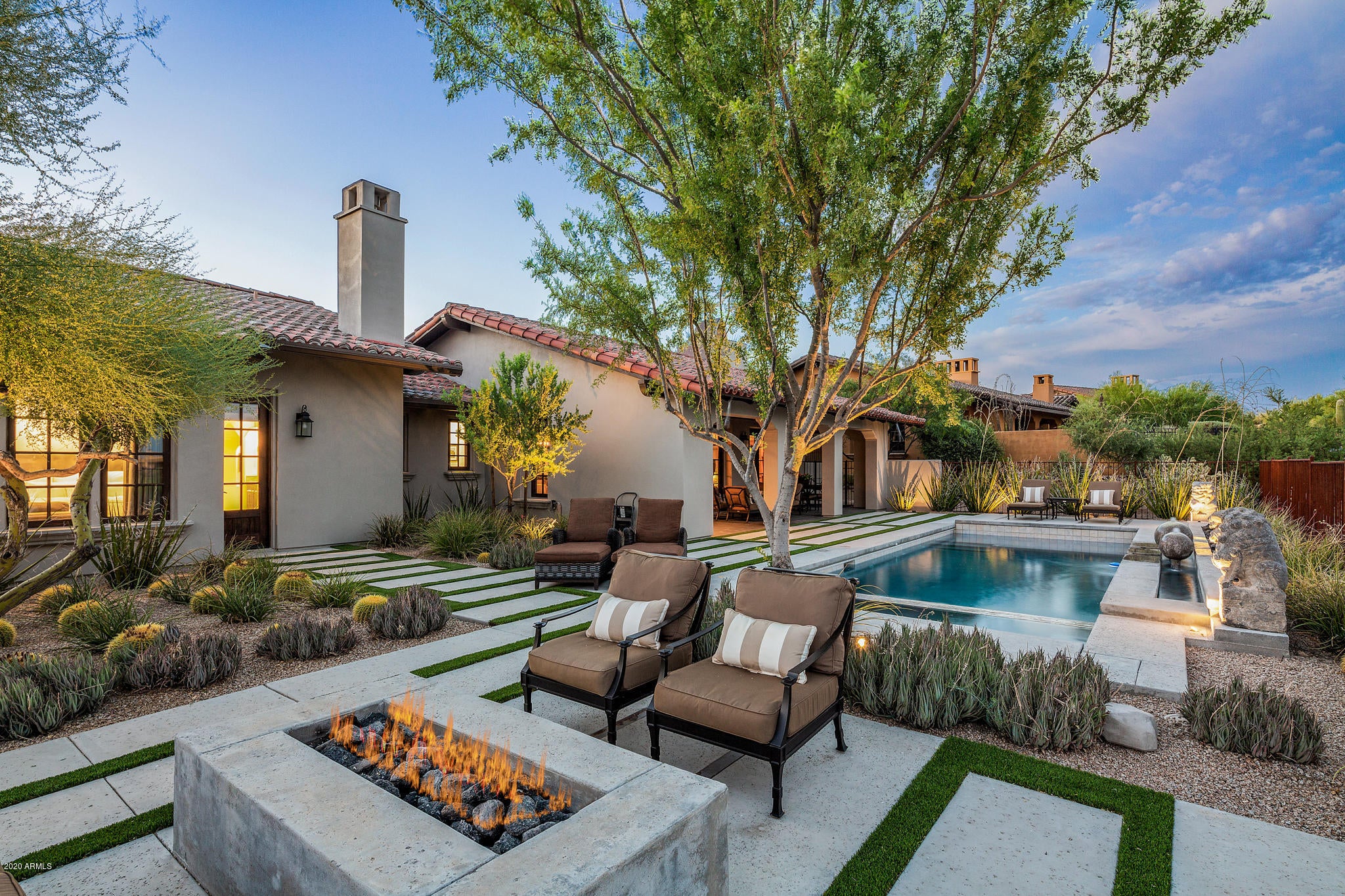 Gorgeous highly upgraded ''golf villa'' located directly across the street from Mirabel's Desert Lodge style clubhouse. Amazing views of the golf course, the McDowell Mountains, Pinnacle Peak and sunsets. Upgrades include second tier of  kitchen cabinets, built-in cabinetry in great room, beams and tongue and groove wood ceiling in great room, hardwood floors, built-in Sub-Zero wine cooler, pool and spa with automated cover and more. Recent updates include interior paint, new blinds,  dining room light fixture, Kitchen and laundry room countertops, sink and faucet, powder room wall tile, and flooring, back patio resurfaced flooring, exterior paint and wood stained, and Nighscape landscape lighting. Truly one of the nicest El Corazon home in Mirabel with NO STEPS. Big Views. Oversized Lot.