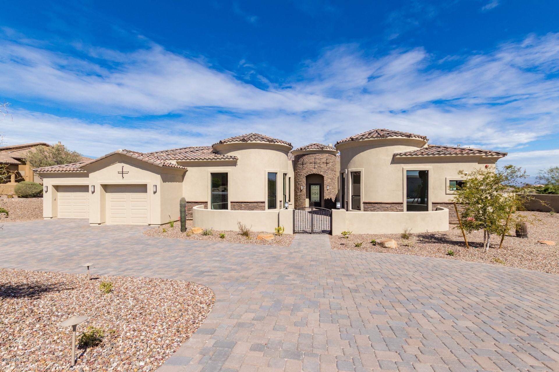 Newly Constructed 4152 Sq Ft Custom Home in Palatial Estates with stunning views of 4Peaks, Gold Fields & McDowell Mtns. This 4 Bedroom (all with En-suite Bathrooms) 4.5 Bath home has many high-end features including expansive back patio accessed by a disappearing pocket patio door, Heated Pool & Spa, Built-in BBQ, all for great Arizona outside living. A Gourmet Kitchen with 48 inch Sub-Zero Refrigerator, 48 inch Wolf Gas Range, Steam Wall Oven & Microwave. Also included is Central Vac, Wifi Door Bell & Security Cameras, 5 zone HVAC  system served by 3-16 Seer units & two Tank-Less Water Heaters. There's 5.5 inches of foam insulation in the walls and 9 inches of top cord truss insulation in the ceiling. An over sized 4 car garage with sealed concrete floors rounds out this incredible home.