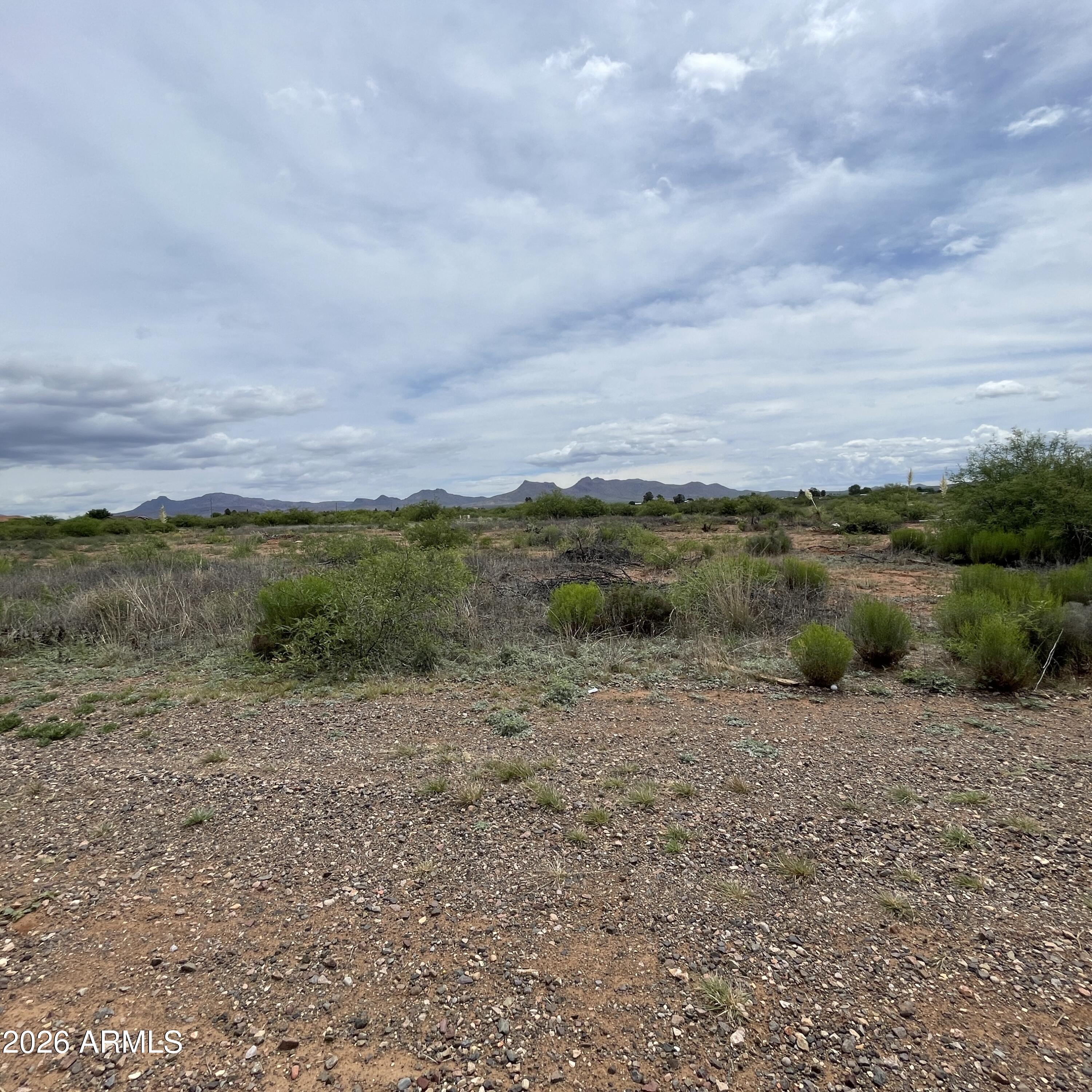 2 lots for sale totaling 3 acres, one 2 acre parcel and one 1 acre parcel.  Gated location close to golf course and fairgrounds, this space provides an ideal scenario for rural living with proximity to town.   All utilities are located at E Golf Course Rd.  No improvements have been made to either lot.   Parcel numbers  41010001S and 41010001M included in sale.  Parcel number 41010001S has a utility easement along the long end of the property, easement does not convey.  Parcel size on county records for 41010001S lists 3.195 acres, one acre includes utility easement that does not convey.