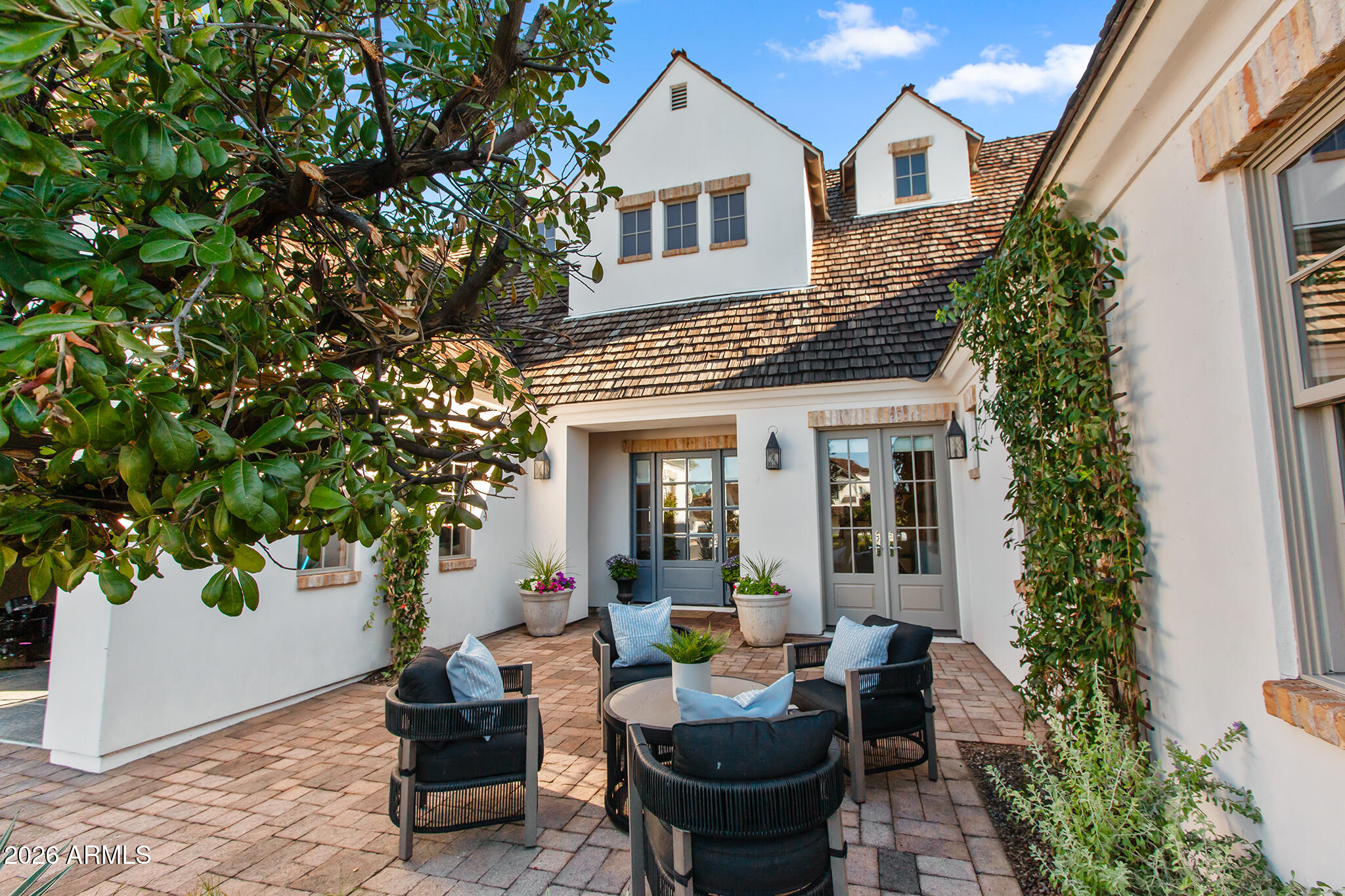 A STUNNING home set within an EXCLUSIVE CUL-DE-SAC NORTH OF EXETER, this exceptional residence offers a rare blend of timeless elegance, privacy, and access to the highly coveted community, Hopi School District.  A dramatic entry sets the tone, welcoming you into living spaces enriched with exceptional craftsmanship. SPECIALTY WOODWORK, including wood cased windows, custom wainscoting and crown molding, pairs seamlessly with imported hand-painted Italian tile and wide-plank French oak flooring, creating an atmosphere of understated luxury .  The expansive family room features pocket sliding doors that open effortless out to CAMELBACK MTN VIEWS.  The PRIMARY SUITE IS ON THE MAIN LEVEL along w two other bedrooms which allows a single level living capability.  5 min to Old Town Scottsdale. Upstairs there are two private bedroom suites that are complemented by a spacious bonus/theatre room with wet bar and balcony.  An additional game room or office offers flexibility for work, study, and recreation.

The outdoor living experience rivals a private resort, featuring a sparkling pool, multiple patios, and a custom outdoor kitchen complete with a built-in grill and firepit--ideal for hosting gatherings or enjoying relaxed evenings under the Arizona sky.

Meticulously maintained and ideally located just five minutes from Old Town Scottsdale, this home places you moments from premier shopping, fine dining, and exclusive fitness amenities, including the Village Health Club. Here, luxury, convenience, and family living come together in one extraordinary offering.