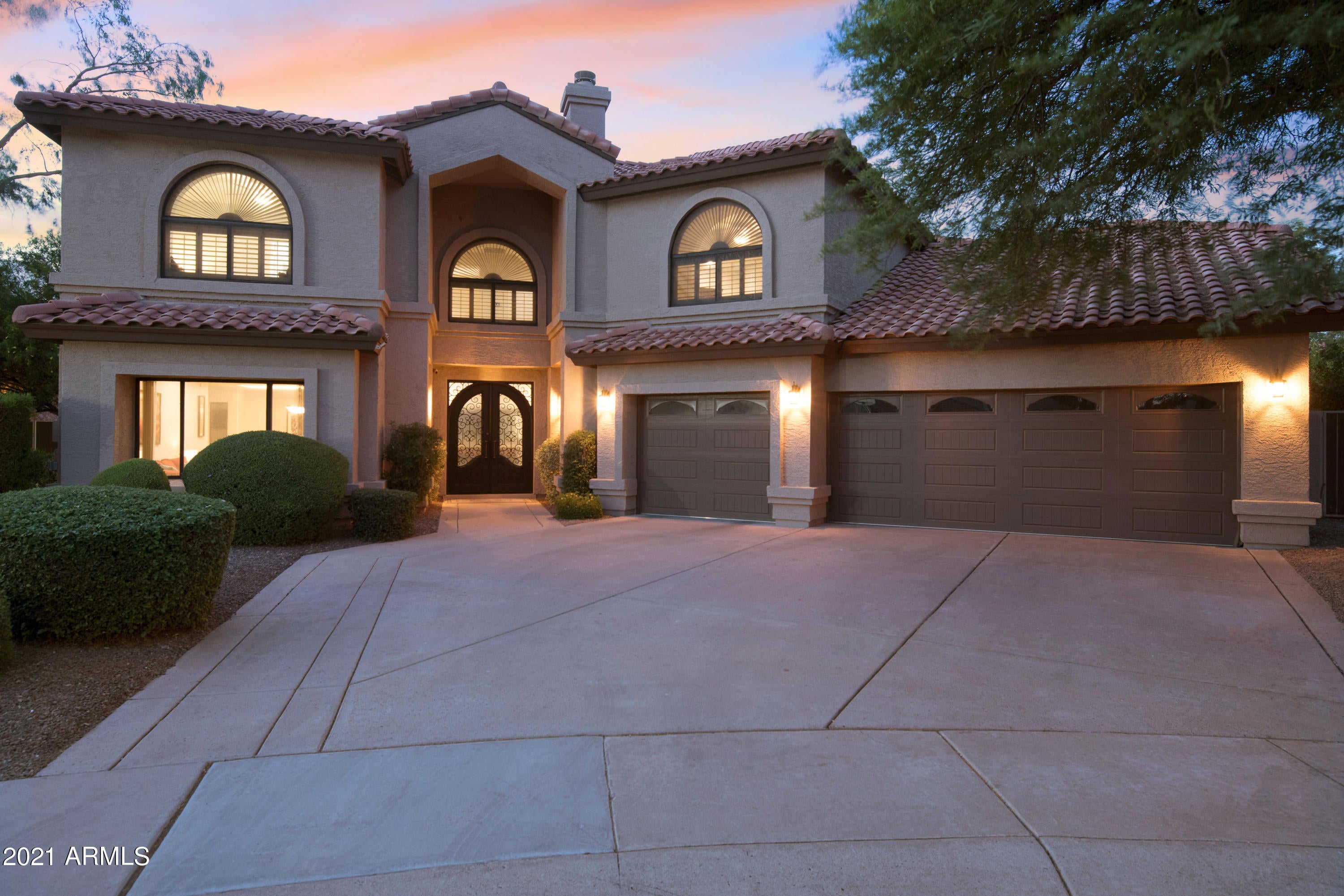 Spectacular custom-built Scottsdale home on quiet cul-de-sac. An entertainer's dream, w/ample spaces, vaulted 20-foot ceilings, 2 fireplaces and a spacious kitchen done with a perfect combination of elegance and charm. The grand master retreat boasts a romantic fireplace, custom walk-in closet and spa like bathroom w/walk-in shower and gorgeous claw foot tub. Updates include iron front door, custom cabinets, all new bathrooms w/quartz countertops and LED lighting. Oversized lot with oasis style backyard that is one of a kind. 3 spacious covered patios, built-in BBQ, RV gate, grass area and mature landscaping complete the destination resort-like feel. New (2019) heated pebble sheen pool w/lounge deck, tunnel water slide, 2 waterfalls, natural boulders and raised spa. Simply outstanding!