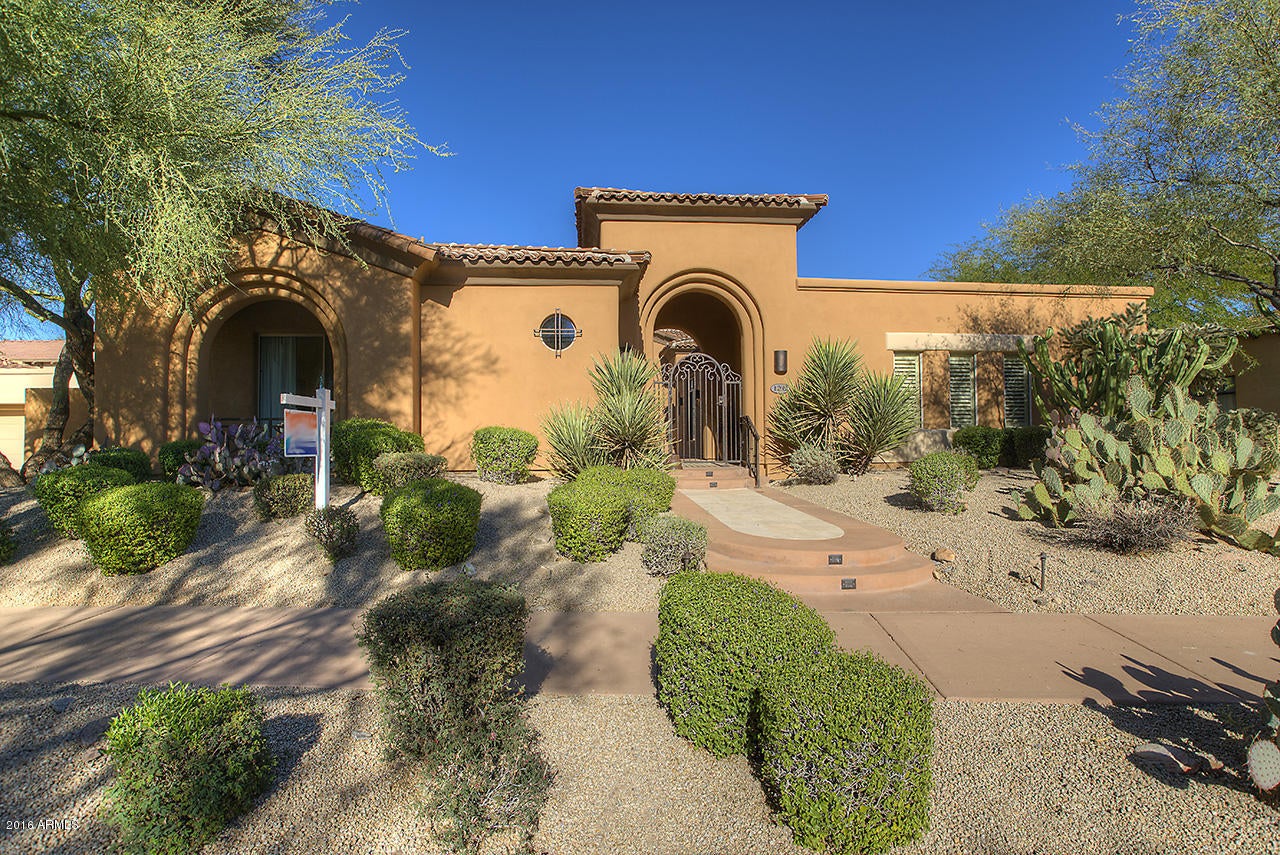 Endless, flowing Golf Course grass just a step out of your back door leading to breathtaking mountain views! This highly coveted Golf Course lot in the private, guard gated DC Ranch Community offers a large bonus room (23’x14’) with separate entry, perfect media/theater room, card room, kids play room, storage room or endless possibilities! The separate guest casita includes a sitting room with fire place, full bathroom, walk-in closet, wet bar and sliding doors leading to the secluded courtyard pool and cabana. The main home features tile flooring throughout the open great room, wood beam ceilings, gas fireplace, formal dining and large picture window full of golf course and mountain views. The kitchen boasts granite countertops, gas cooktop, stainless steel appliances, double ovens, wine refrigerator and a huge walk-in pantry. An office off the great room has a full wall of built-in bookcases and a built-in bar. Enjoy tranquil views from your Owner's Suite with a romantic fireplace and sitting room. The Owner's Ensuite, deluxe size, spa-like bathroom delivers an oversized soaking tub, separate dual vanities, walk-in shower and sitting room area. Enjoy all this and be close to the DC Ranch community centers with pool, fitness room, tennis courts, basketball court and playground and be just minutes from Market Street with dining and shopping.  **New gate, front door and fresh paint all within the last year and a half**