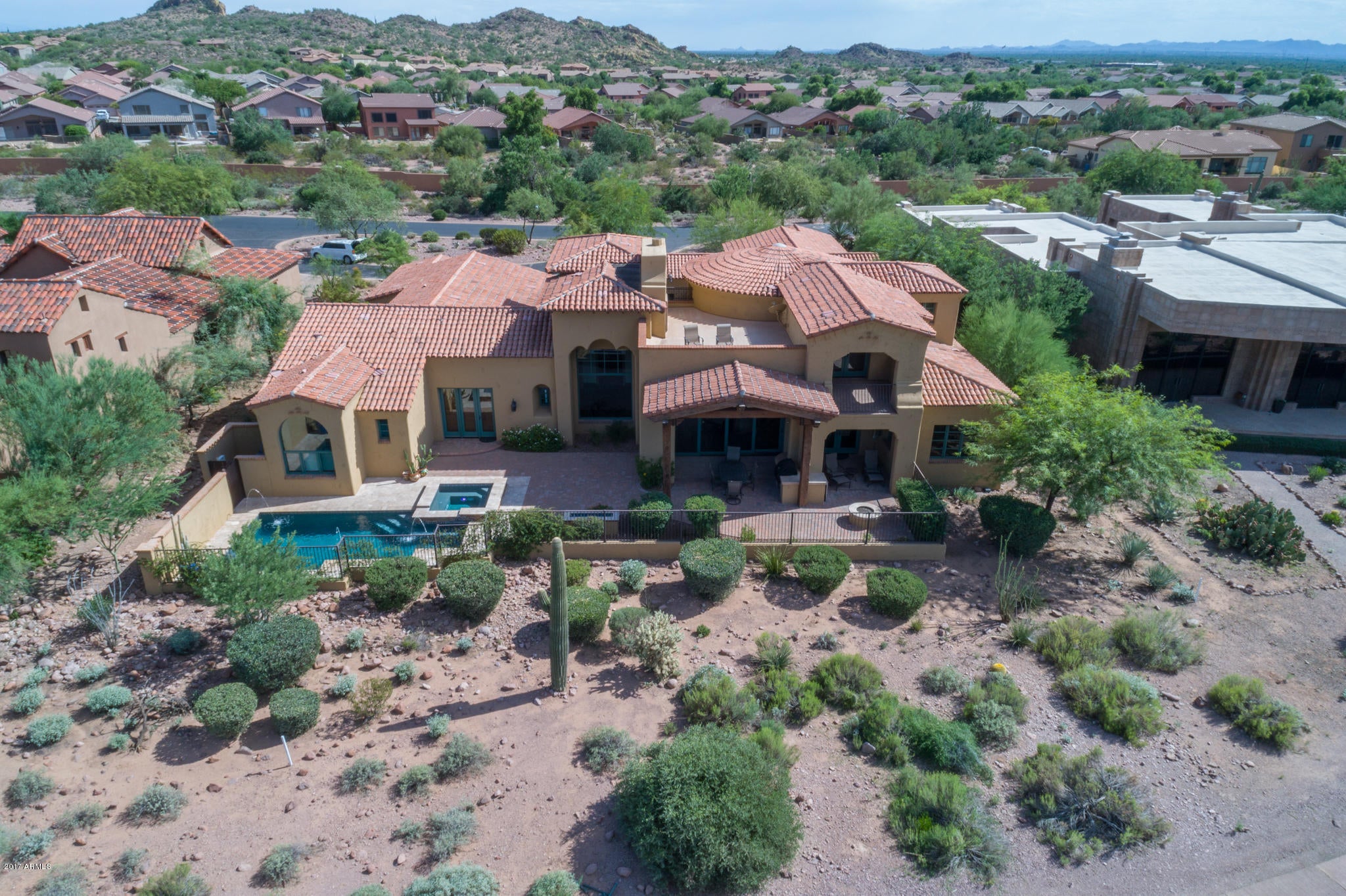 SERIOUS SELLERS=$100K PRICE REDUCTION!! EXQUISITE GOLF FRONT ESTATE AT AN EXCEPTIONAL VALUE $243 PER SQ FT--MUST SEE VIDEO--SPANISH SPLENDOR LOCATED ON NICKLAUS DESIGNED ''LOST GOLD'' GOLF COURSE W/ AMAZING SUPERSTITION MTN VIEWS IN GUARD GATED SUPERSTITION MTN GOLF & COUNTRY CLUB. CUSTOM ELEGANCE THROUGHOUT-IMPECCABLY MAINTAINED-LOVED & LIGHTLY LIVED IN-SHOWS LIKE NEW!  NEW CONSTRUCTION OF THIS CALIBER WOULD BE  WELL OVER $350 PER SQ FT + COST OF LOT, LANDSCAPING & WINDOW TREATMENTS!  DECOMPRESS & SKIP THE STRESS OF BUILDING & EVER-SOARING MATERIAL COSTS. THIS ELABORATE MASTERPIECE IS ''MOVE-IN READY'' HAS DESIRABLE OPEN CONCEPT, A 3-RM GUEST CASITA W/ COVERED PATIO, GORGEOUS 6'' PLANK RECLAIMED OAK FLOORS, BEAUTIFUL SOLID KNOTTY ALDER BOX BEAMS, CABINETS & MILLWORK, AWESOME FLEX BASEMENT PERFECT FOR MEDIA/GAME/FITNESS/DEN/OFFICE OR MAN CAVE--HAS BEAUTIFUL 1/2 BATH & IS EQUIPPED WITH WETBAR, WINE COOLER & ICE-MAKER! EPICUREAN KITCHEN HAS 2 ISLANDS WITH WALNUT BUTCHER BLOCK COUNTERTOPS, ASHLEY NORTON HARDWARE, IMPORTED LIGHT FIXTURES, 2 DISHWASHERS, 2 SINKS, 72"COMMERCIAL SIZE VIKING SIDE X SIDE REFRIGERATOR/FREEZER WITH INTEGRATED CARVED ALDER WOOD PANELS, BUTLER'S SERVICE AREA, LARGE WALK-IN PANTRY, EAT-IN KITCHEN. GORGEOUS 6" PLANK RECLAIMED OAK FLOORING, CREAMY & LIGHT VENETIAN PLASTER WALLS, LOVELY IMPORTED HAND-PAINTED SPANISH TILES, TRAVERTINE & LIMESTONE COUNTERS, $5K H2o CONCEPTS WHOLE HOUSE WATER FILTRATION SYSTEM, TOTO SINKS & TOILETS, KOHLER FAUCETS.  TRANQUIL & PRIVATE OWNER'S SUITE HAS COFFEE BAR/SINK/REFRIG, ELEGANT BATH WITH HIS & HER WATER CLOSETS, EXPANSIVE CLASSIC CUSTOM CLOSET, PRIVATE EXIT AND IS SPLIT FROM GUEST WING!  YOUR GUESTS WILL LOVE THE PRIVACY OF THE 3-ROOM CASITA, MAIN HOUSE GUEST ENSUITE OR THE UPPER CARRIAGE ENSUITE (BEING UTILIZED AS A STUDY/DEN) BOASTING UNPARALLELED VIEWS FROM PRIVATE BALCONY!  ENCLOSED BACKYARD WITH WROUGHT IRON FENCING. STUNNING SUPERSTITION MOUNTAIN, GOLF COURSE, & SUNSET VIEWS! OWNERS INSTALLED POOL & SPA WITH WATER FEATURE, FIRE FEATURE (CAN  SEE THE MOMENT YOU OPEN THE FRONT DOOR THRU THE OVERSIZED PICTURE WINDOW), FIREPIT & BUILT-IN WOLF BBQ! NEW LANDSCAPE DRIP IRRIGATION 2018. FABULOUS 360 VIEWS FROM THE OBSERVATION DECK. FURNISHINGS AVAILABLE ON SEPARATE BILL OF SALE OUTSIDE OF ESCROW. OVER-THE-TOP FINE FINISHES IN THIS PALATIAL ESTATE ARE A MUST SEE AND SURE TO PLEASE THE MOST DISCERNING BUYER! CALL TODAY FOR YOUR PRIVATE TOUR.