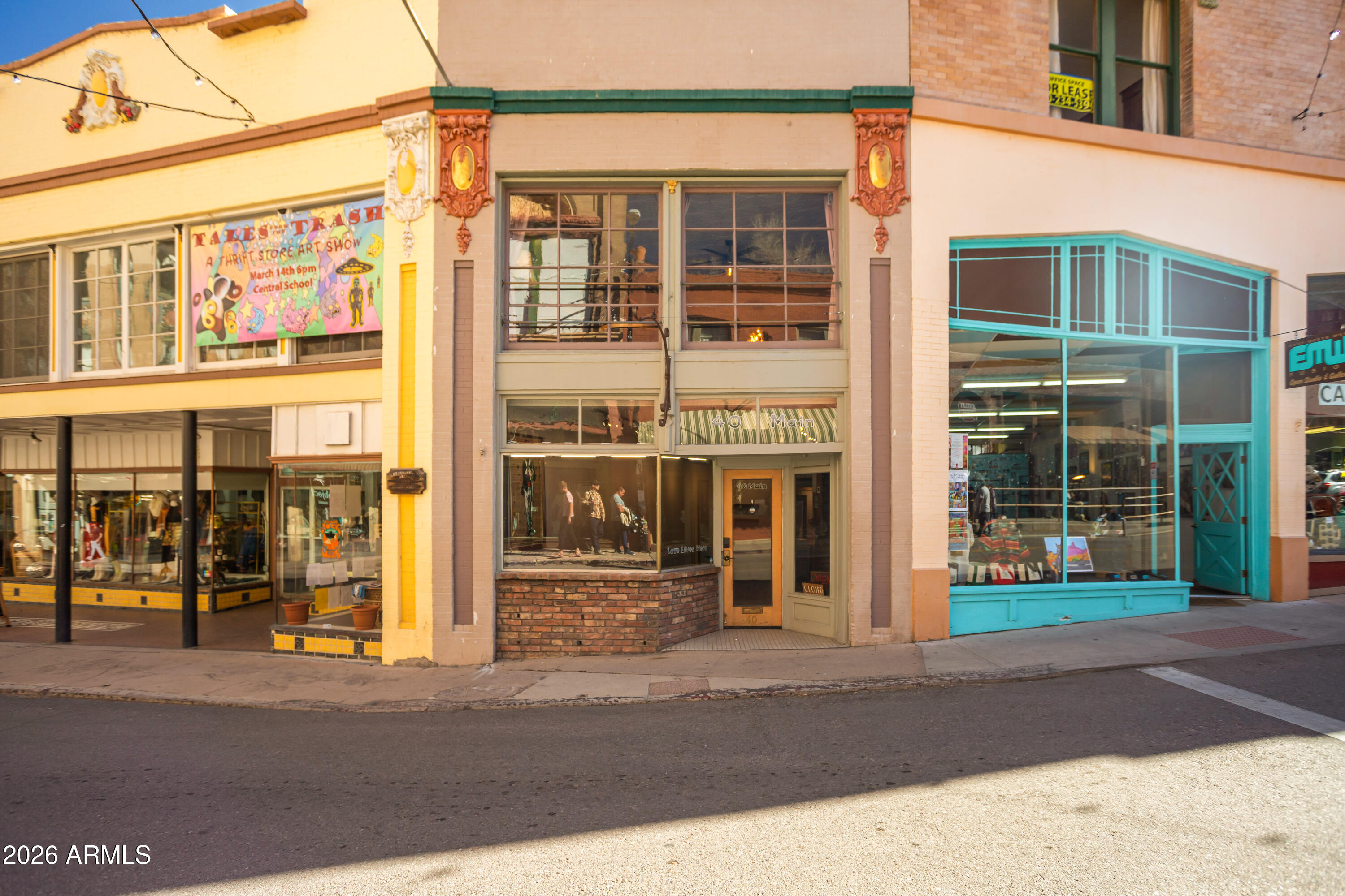 Heading down historic Main Street in Old Bisbee, you'll find 40 Main conveniently located in the middle of shops, cafes, bars and restaurants. This 1904 building offers a gallery/storefront space, as well as a 1br apartment on the 2nd level. The apartment features the original staircase, hardwood floors, tin ceilings and 6ft in-swing casement windows. All furnishings to be included (outside of escrow). Move right in or use it as a turn-key rental. Historic charm to enjoy at every turn, like the gallery's half bath that used to be the walk-in safe for the store next door. Recent work includes plumbing/electrical updated in 2023 (200amp panels), all new appliances and water heater (2023), and 3 layers of top UV and fire resistant roll-on roofing material.See Residential Listing MLS# 7001054.