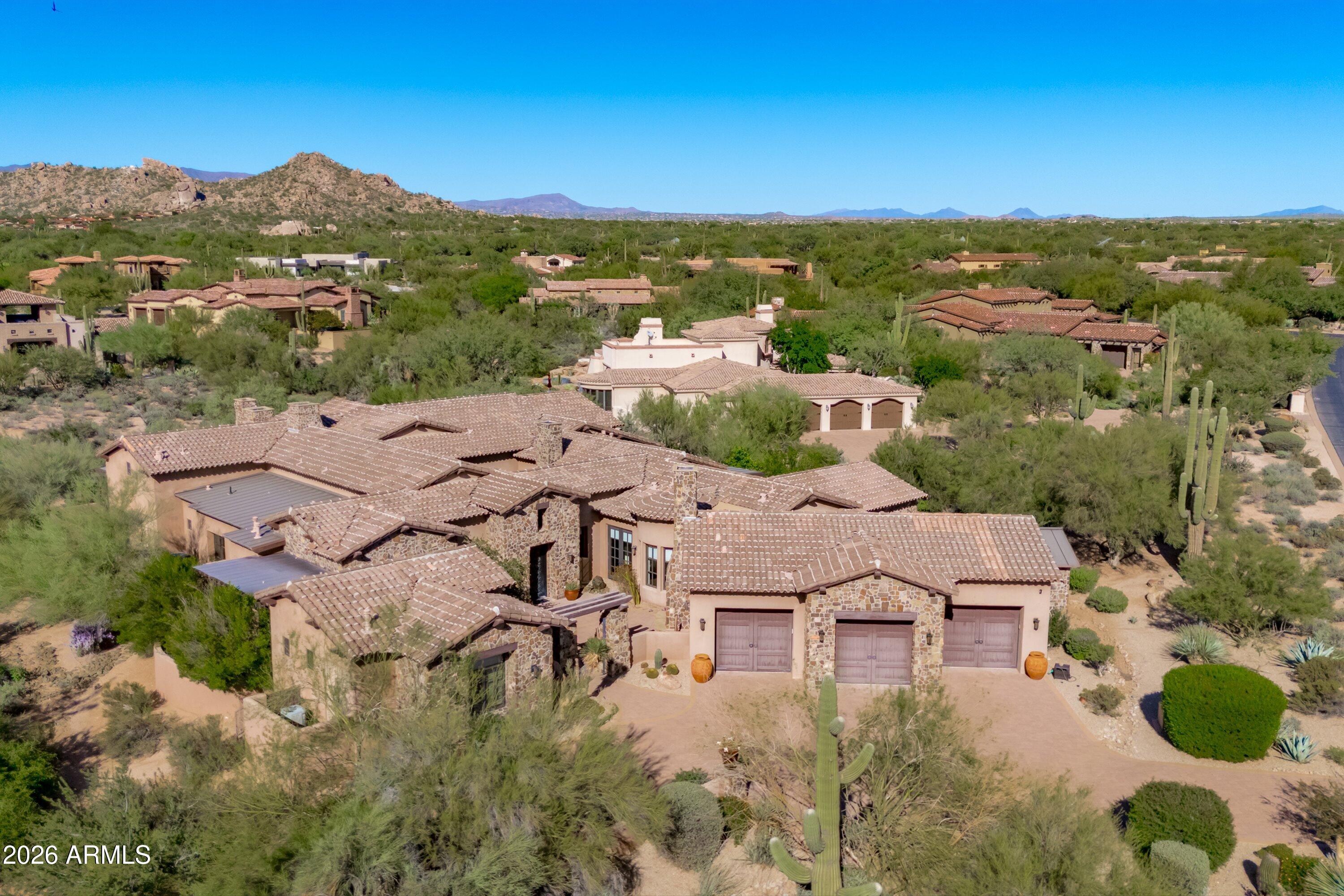 Single-level custom estate in Whisper Rock, North Scottsdale's most exclusive guard-gated golf community. 5,210 SF main residence plus private casita 452 sq.ft-- soaring beamed ceilings, 5 fireplaces, chef's kitchen with Wolf & Sub-Zero, spa-inspired primary suite, resort pool & spa, 3-car garage, and breathtaking mountain views. No interior steps. Authentic craftsmanship with warm, rich finishes throughout. Entertainer's courtyards and seamless indoor-outdoor Arizona living. 24-hr guard gate, world-class Weiskopf & Mickelson golf, tennis & fitness. Best price per square foot of any active listing in Whisper Rock. For buyers relocating from Washington, California, Texas, Illinois, South Dakota & Nebraska -- no state income tax, 300+ days of sunshine, lock-and-leave luxury. Rock.

Whisper Rock residents enjoy two championship golf courses, fitness facilities, tennis and pickleball, concierge services, and a strong sense of community, all within minutes of North Scottsdale dining, shopping, hiking trails, and freeway access.

Whether you're seeking a primary residence, seasonal escape, or investment in Scottsdale luxury real estate, this property represents true potential in one of the Valley's most sought-after neighborhoods.