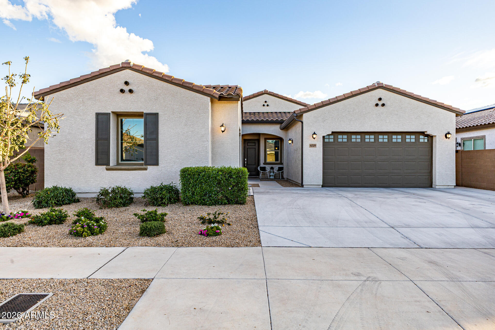 Stunning Lennar Next-Gen home offering the perfect blend of luxury, flexibility & resort-style living. This rare single-level design features a private attached casita with its own separate entrance, private backyard space, living room, upgraded full-size kitchen, bedroom, bathroom, laundry room & a private 1-car garage. Ideal for multigenerational living, extended guests, a private home office, or extra living space. The main residence is equally impressive with an open-concept floorplan, upgraded wood-look plank tile flooring, soaring ceilings & a dramatic 12-foot glass slider that seamlessly opens to the backyard,  creating incredible indoor-outdoor living.  The gourmet kitchen is truly a showstopper featuring Platinum Chef upgrades with high-end GE Monogram appliances, a 6 burner gas cooktop with designer knobs & custom hood, 5-in-1 oven that is a precision speed cook, convection, toaster, warming & microwave all in one. Also, a beverage fridge, tile backsplash, extended cabinetry, granite countertops & an oversized island make this kitchen perfect for entertaining. The spacious bedrooms offer comfort & style, while the primary suite features dual sinks, a large walk-in glass shower & an incredible walk-in closet. Step outside to your private backyard retreat complete with an expansive patio, artificial turf, putting green, several citrus trees including Mandarin, Lemon, Orange & Tangelo. Lush landscaping & easy maintenance designed for relaxing & entertaining. Additional upgrades include a whole-home water filtration system, reverse osmosis system & custom touches throughout. Enjoy beautiful mountain views, nearby parks, hiking trails, shopping, dining & convenient freeway access. Immaculate, thoughtfully upgraded & truly one-of-a-kind.