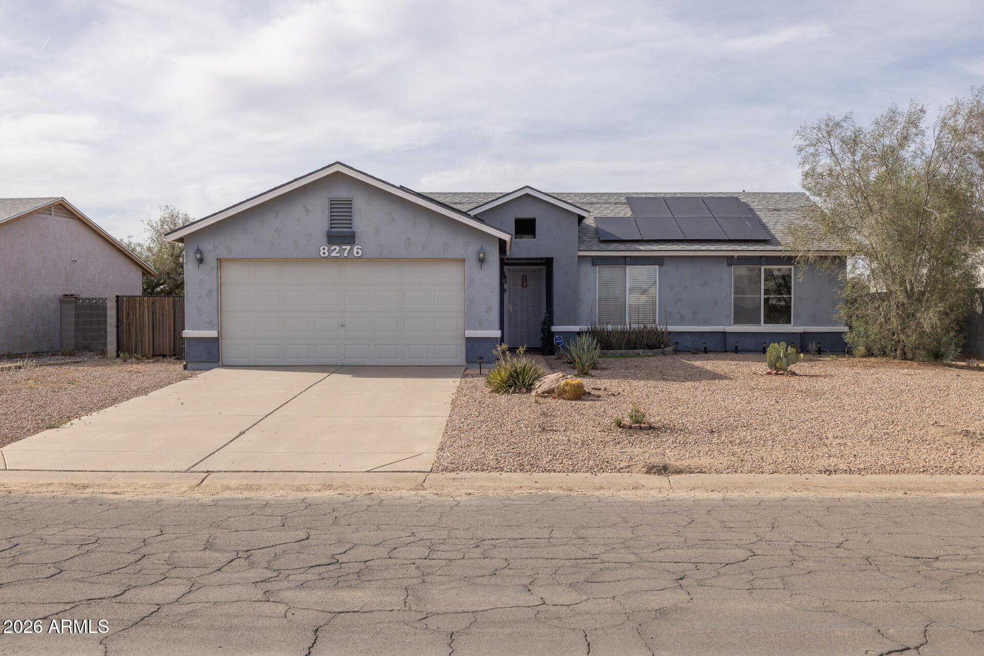 Located on a large homesite with NO HOA, this home offers 3 bedrooms & 2 baths. The living area has vaulted ceilings and a cozy fireplace with stone surround. The kitchen features recessed lighting, a center island with extra storage, a pantry, and electric appliances. Sliding doors open up to the patio which has a roll-down shade, and a large backyard with desert landscaping and artificial turf, garden beds, and an additional patio, perfect for your BBQ. The primary bedroom has a private bath with an extended vanity, tub/shower combo & walk-in closet. Other features: 2-car garage and  solar providing utility savings. Convenient access to I-8 & I-10, golf, retail, and nearby restaurants.