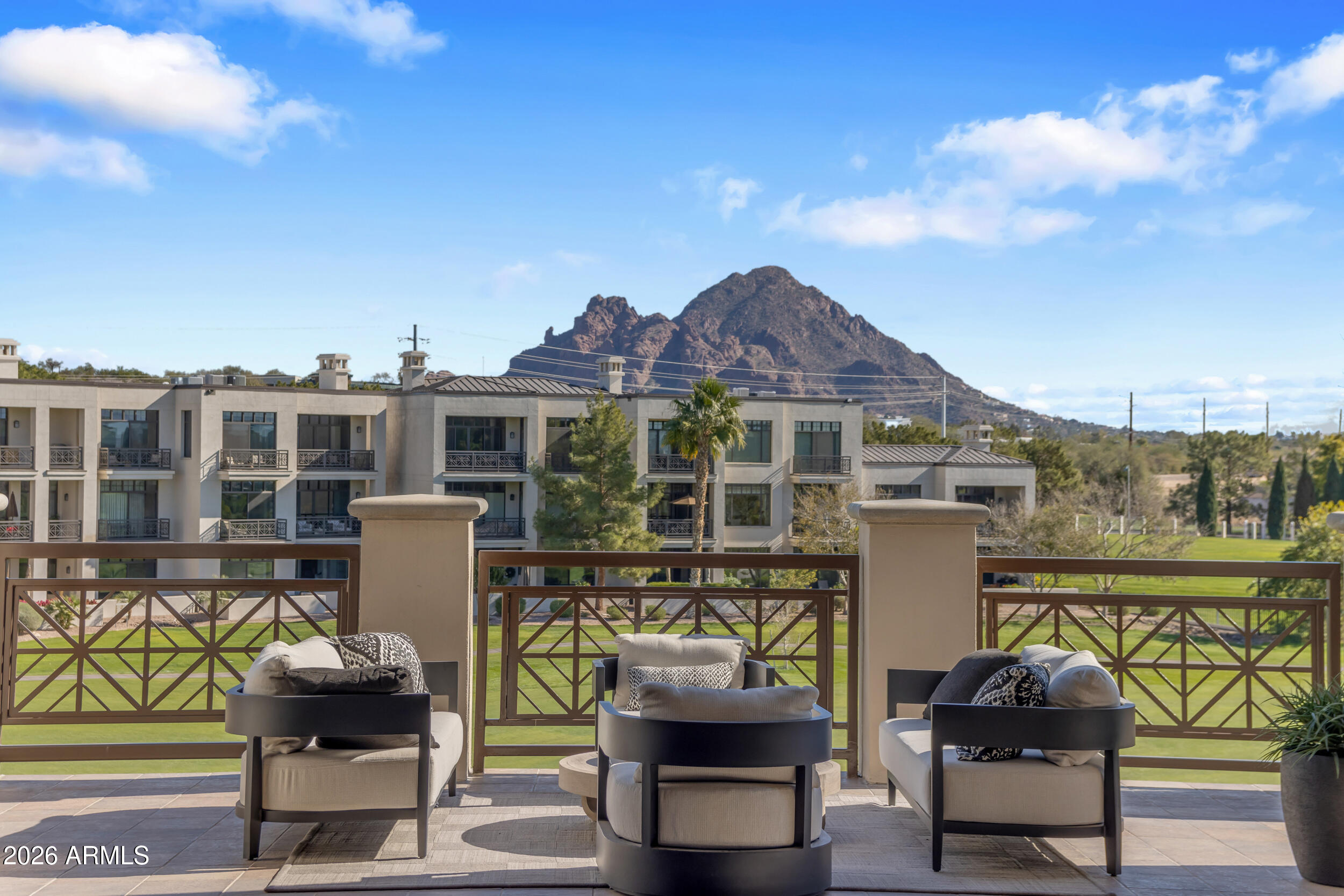 Welcome to Residence 313 at Two Biltmore Estates—one of the largest and most luxurious penthouses in all of Arizona with gorgeous MOUNTAIN VIEWS and GOLF COURSE VIEWS! This rare opportunity in a prestigious, gated community blends timeless architecture with refined modern elegance. Ideally located in the heart of the historic Biltmore Circle, Residence 313 has been completely re-imagined to epitomize upscale living. From the moment you step inside, it's clear this is no ordinary condominium. Soaring ceilings, French white oak flooring, and custom designer paint by world-renowned Anna Sadler of Surface Refinements set the stage for sophistication. Three expansive patios for relaxing and enjoying Arizona's beautiful weather with plenty of space for entertaining. Meticulously remodeled with the latest in luxury design and color palettes, the residence features French oak hardwood floors throughout, Carrera Bella marble in the bathrooms, and striking custom lighting fixtures. The thoughtful split floor plan lends itself beautifully to both entertaining and everyday relaxation, with seamless indoor-outdoor living.

No detail was overlookedfrom Brizo and Waterworks fixtures, to high-end appliances, custom cabinetry and countertops, and a stunning fireplace surround. The architecture pays homage to the Biltmore tradition inspired by Frank Lloyd Wright, while the location offers unmatched conveniencejust steps from the recently re-designed Estates Golf Course, world-class dining, upscale shopping, and the iconic Arizona Biltmore Resort.

Experience elevated, lock-and-leave living at its finest. Welcome home to Two Biltmore Estates 313.