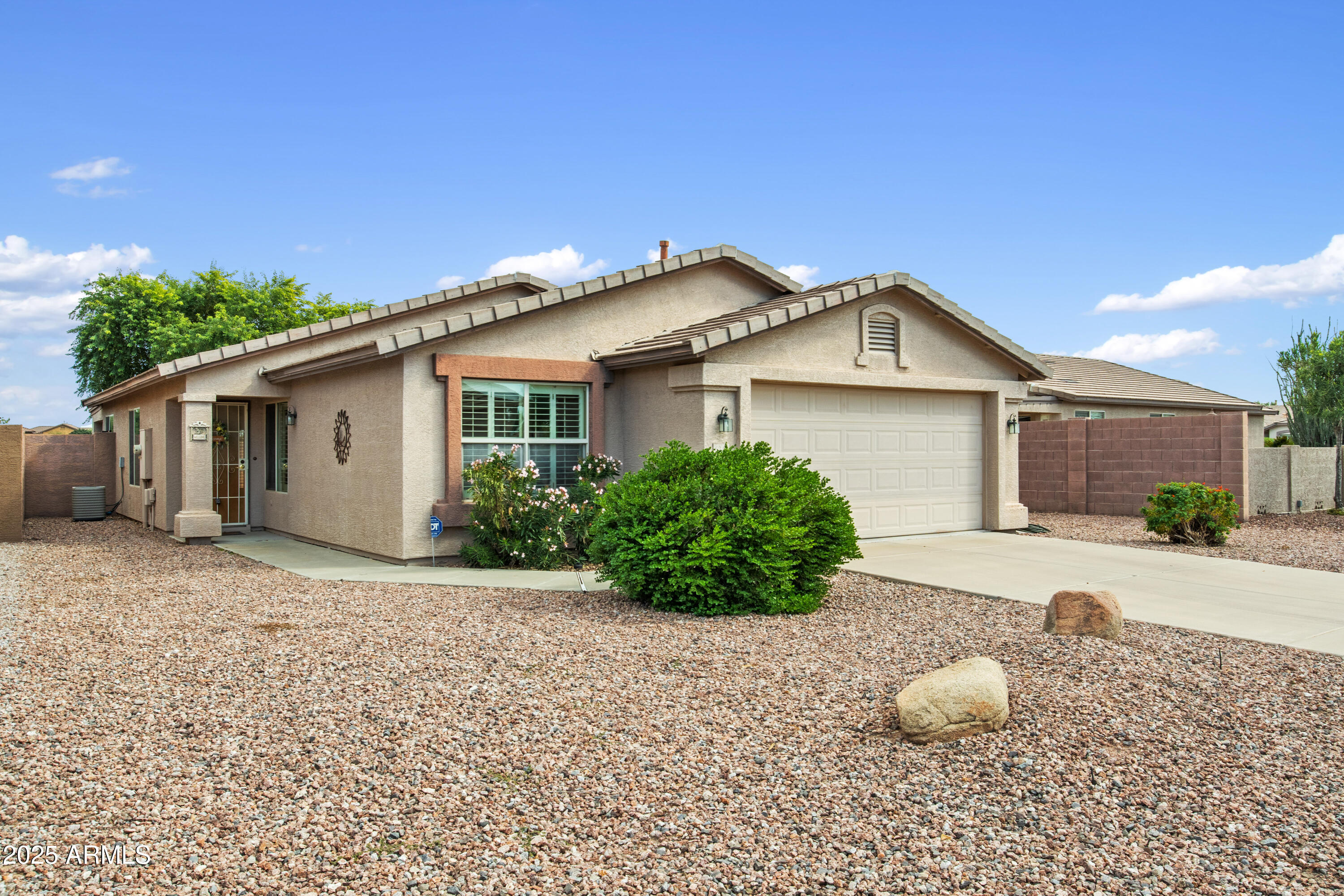 Welcome to this beautifully maintained 2 bedroom, 2 bath + Den home nestled in the desirable active adult community of Solera. Designed for easy living, this home features low-maintenance front and back yards.  Inside, you'll find plantation shutters on every window, tile flooring in high-traffic areas, and cozy carpet in the bedrooms for added comfort.  Enjoy relaxing on the covered patio surrounded by low-care desert landscaping—perfect for quiet mornings or evening gatherings.

Residents of Solera enjoy an exceptional lifestyle with access to a recreation center, sparkling pool, golf course, pickleball courts, fitness center, and more. Experience resort-style living every day in this inviting community!