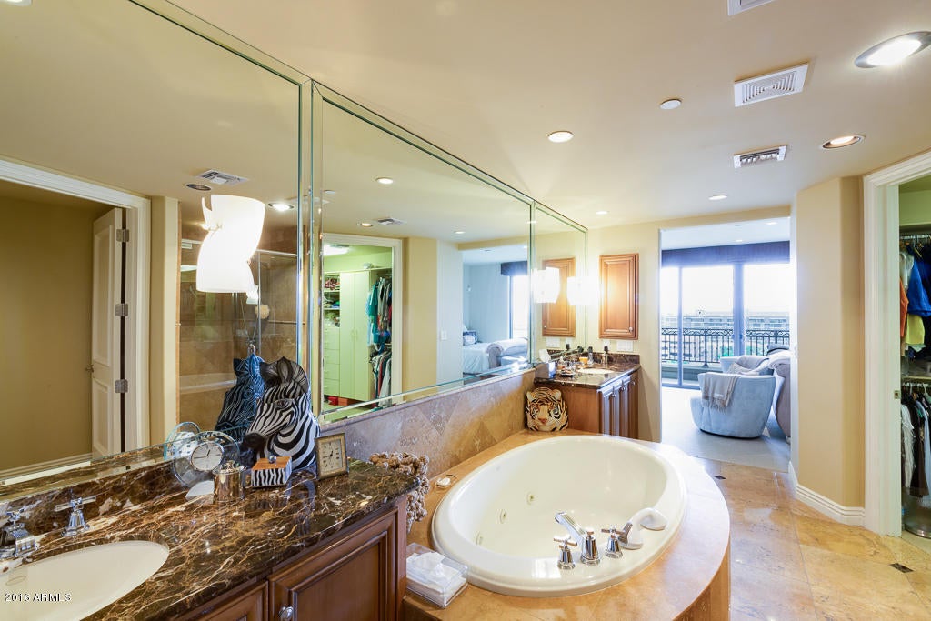 Beautifully appointed condo in a spectacular upscale building on the Waterfront. Full Fitness Center, Concierge Services, Rooftop Pool, Spa and Outdoor BBQ and Kitchen. 
Condo has designer finishes, 2 bedrooms plus a separate office. Two balconies with excellent panoramic views and incredible night time views.Exclude entry hall light fixture, light fixture over dining room table and light fixtures on master bath mirrors.
