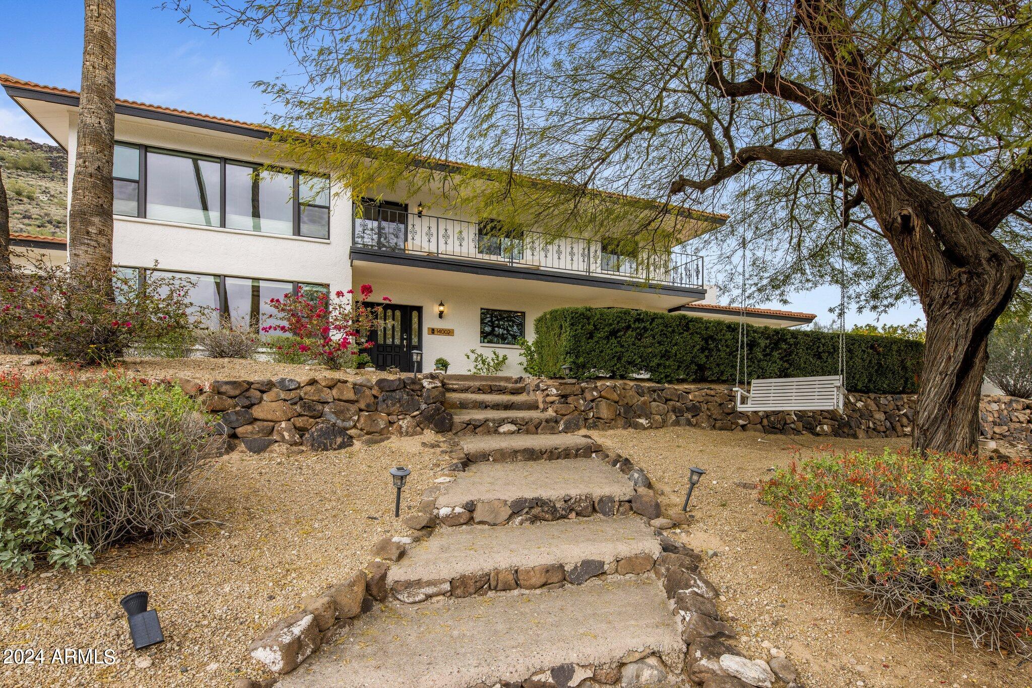 Fully renovated hillside home in Moon Valley featuring 3,635sf main home + 600sf guest home. You'll love the open kitchen with Affinity custom cabinetry (lifetime warranty!), Thermador appliances (induction cooktop + double ovens), ice maker, beverage fridge, quartz counters, walk-in pantry and under-cabinet lighting and outlets. Home features hardwood floors and dual-pane doors and windows throughout. All bathrooms have been remodeled, including a 2nd laundry added in upstairs bathroom. Main home has 4 bedrooms + bonus room. Guest house includes bedroom, bathroom and living area perfect for an office or guests. Gorgeous mountainside backyard with pergola, outdoor entertainment area, play pool, and artificial turf. 3 Trane AC units installed 2020. Whole house filtration system in 2022.